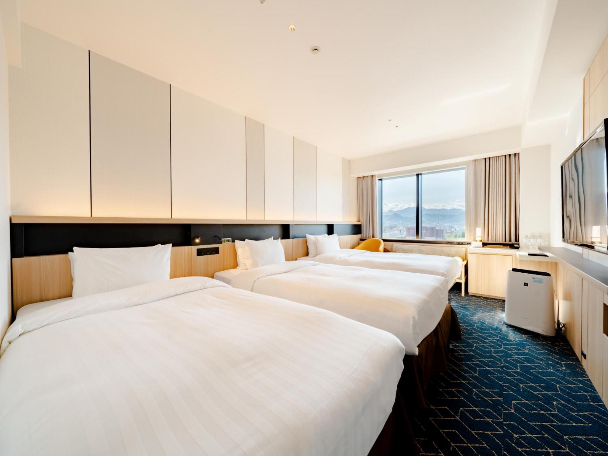 Twin Room for 3 People with Extra Bed - Non-Smoking photo 1