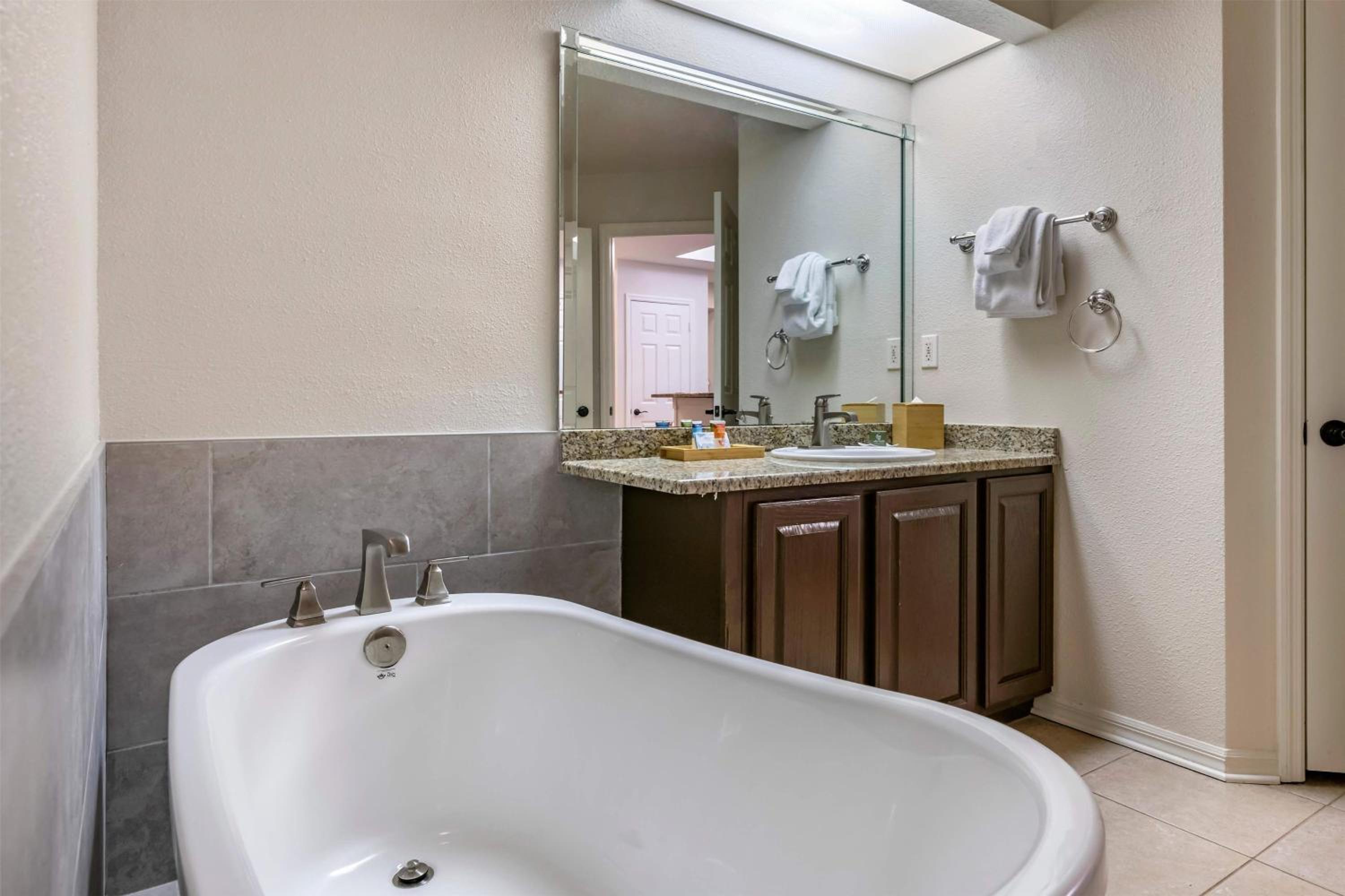 Two-Bedroom Deluxe Suite with One King Bed, Two Double Beds and Golf View