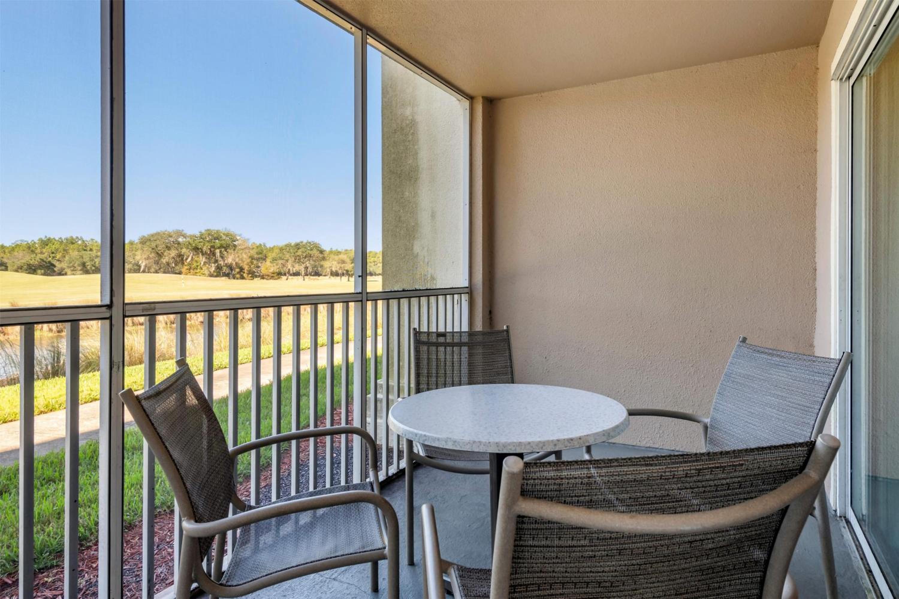 Two-Bedroom Deluxe Suite with One King Bed, Two Double Beds and Golf View