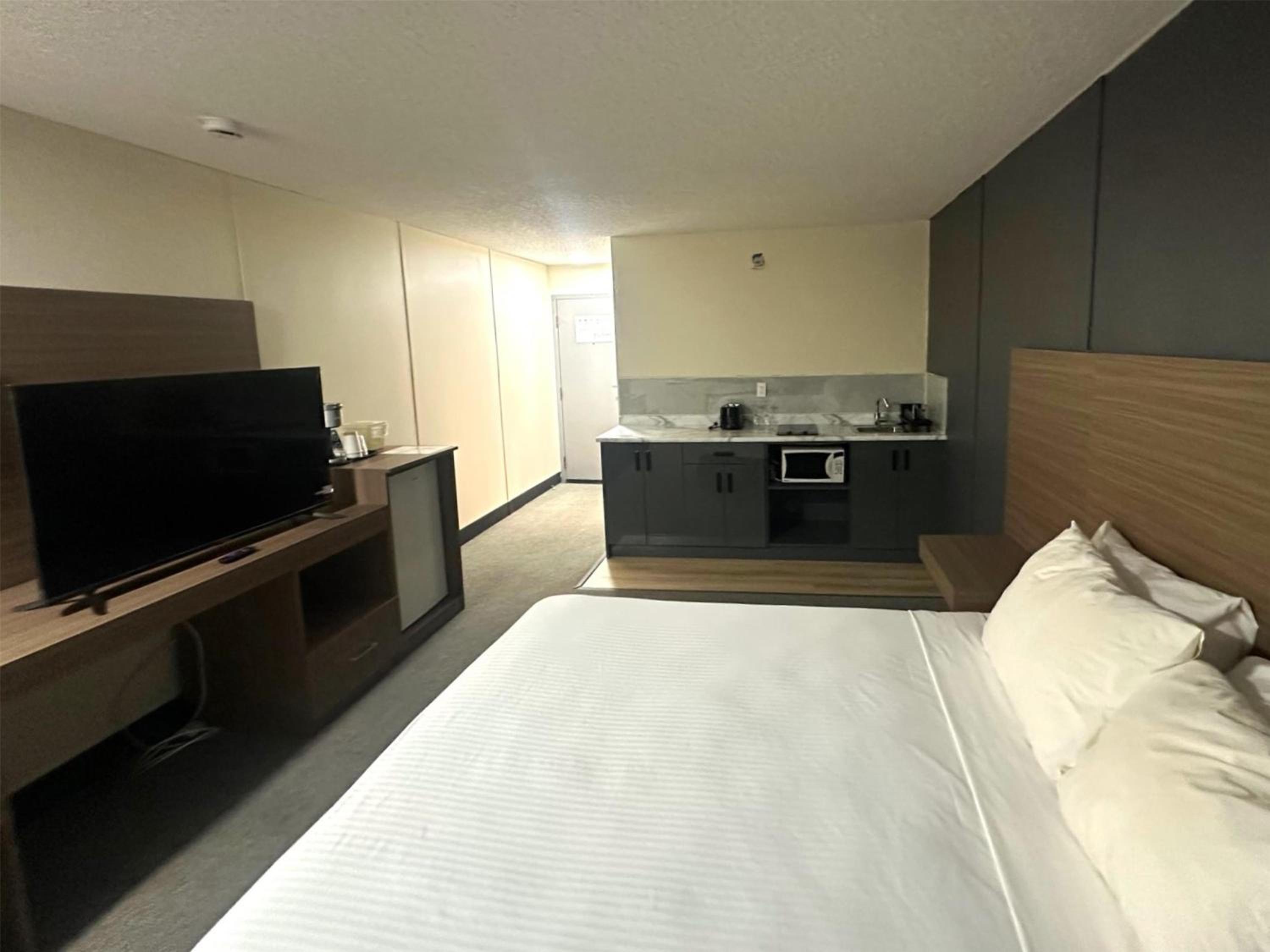Two-Bedroom Family Suite with Three Queen Beds and Kitchenette - Non-Smoking