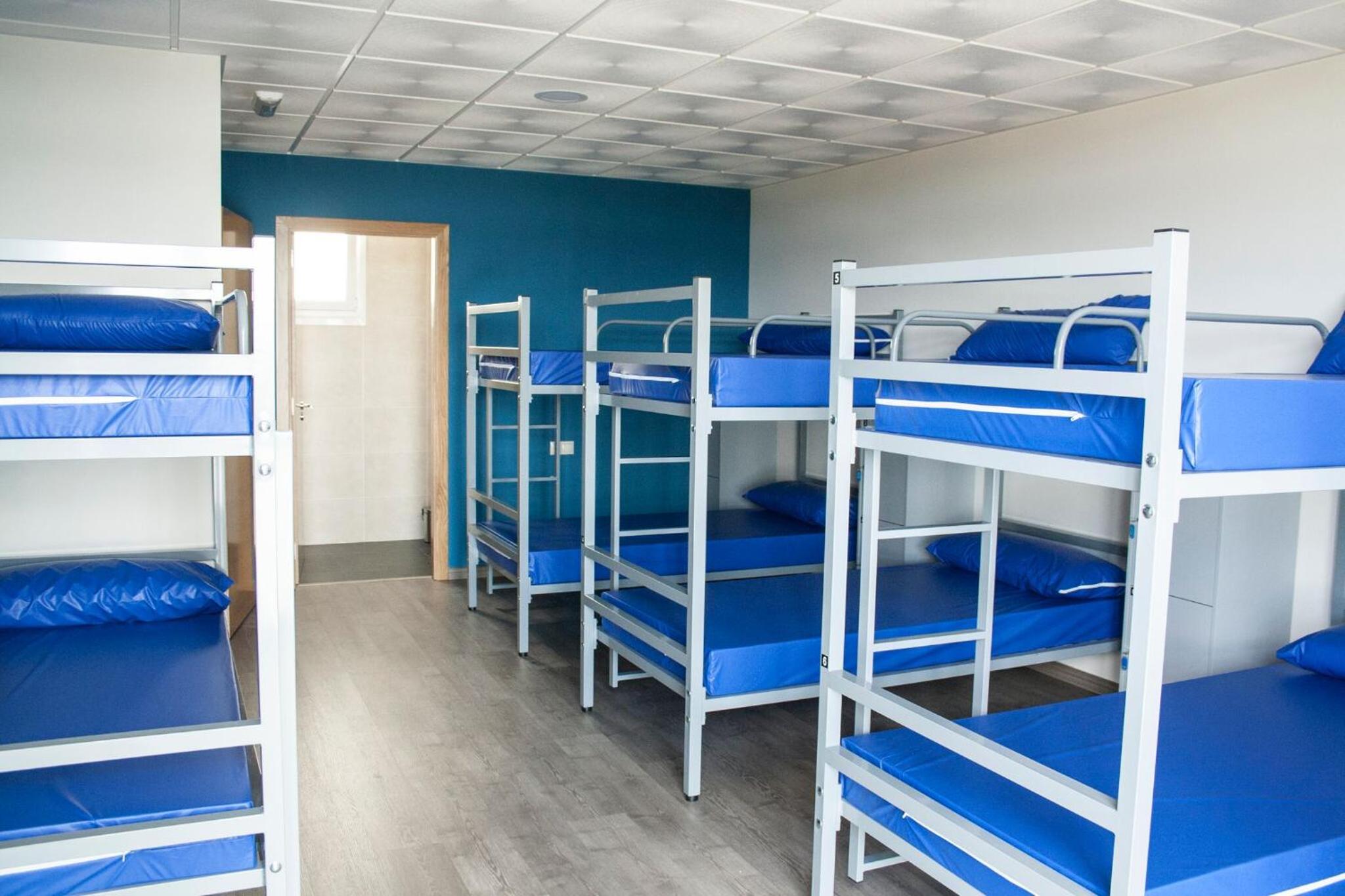 Cama en Dormitorio Mixto de 10 Camas
