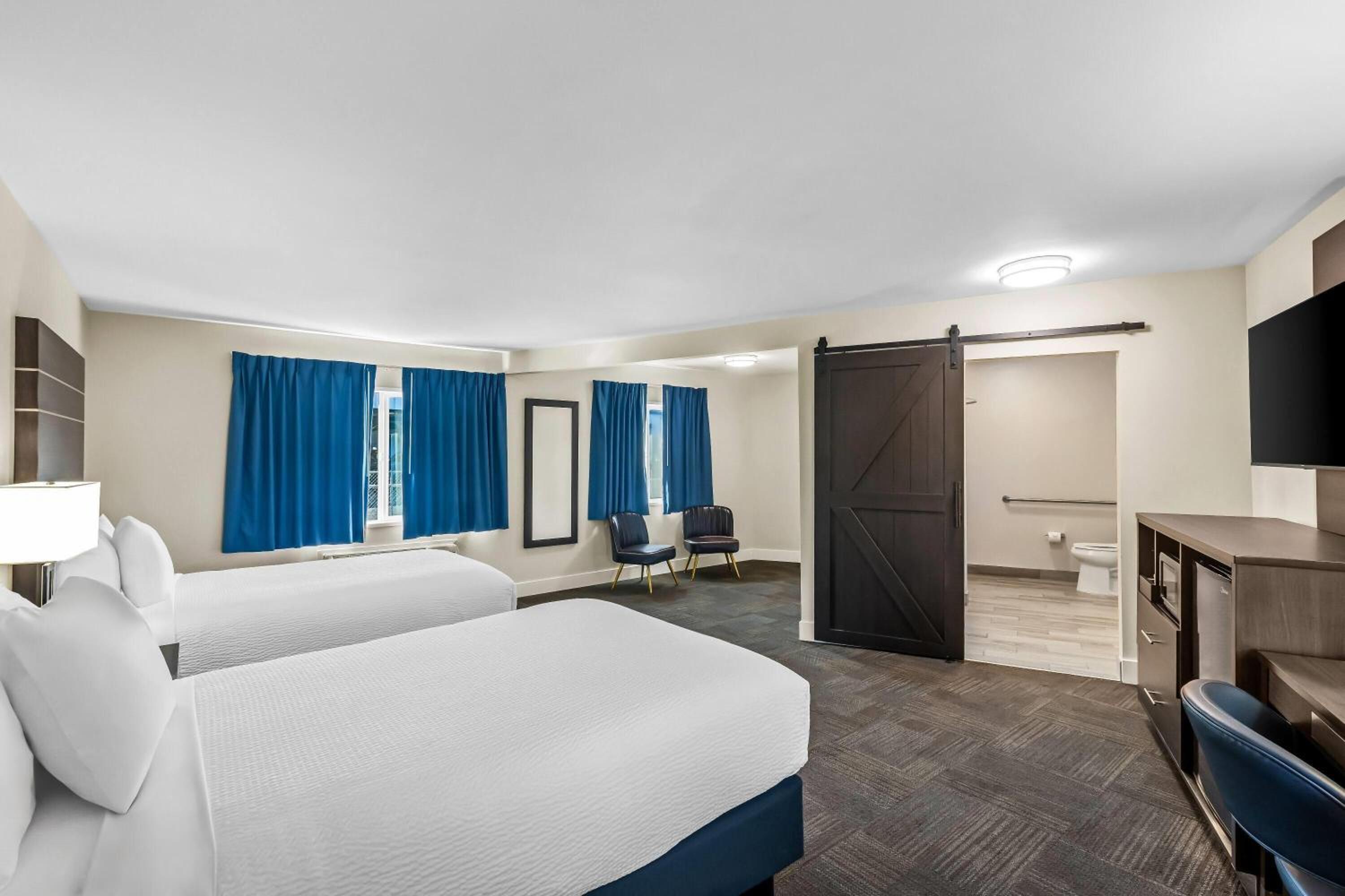 Room with Two Double Beds and Mobility/Hearing Access - Bathtub with Grab Bars - Non-Smoking photo 1