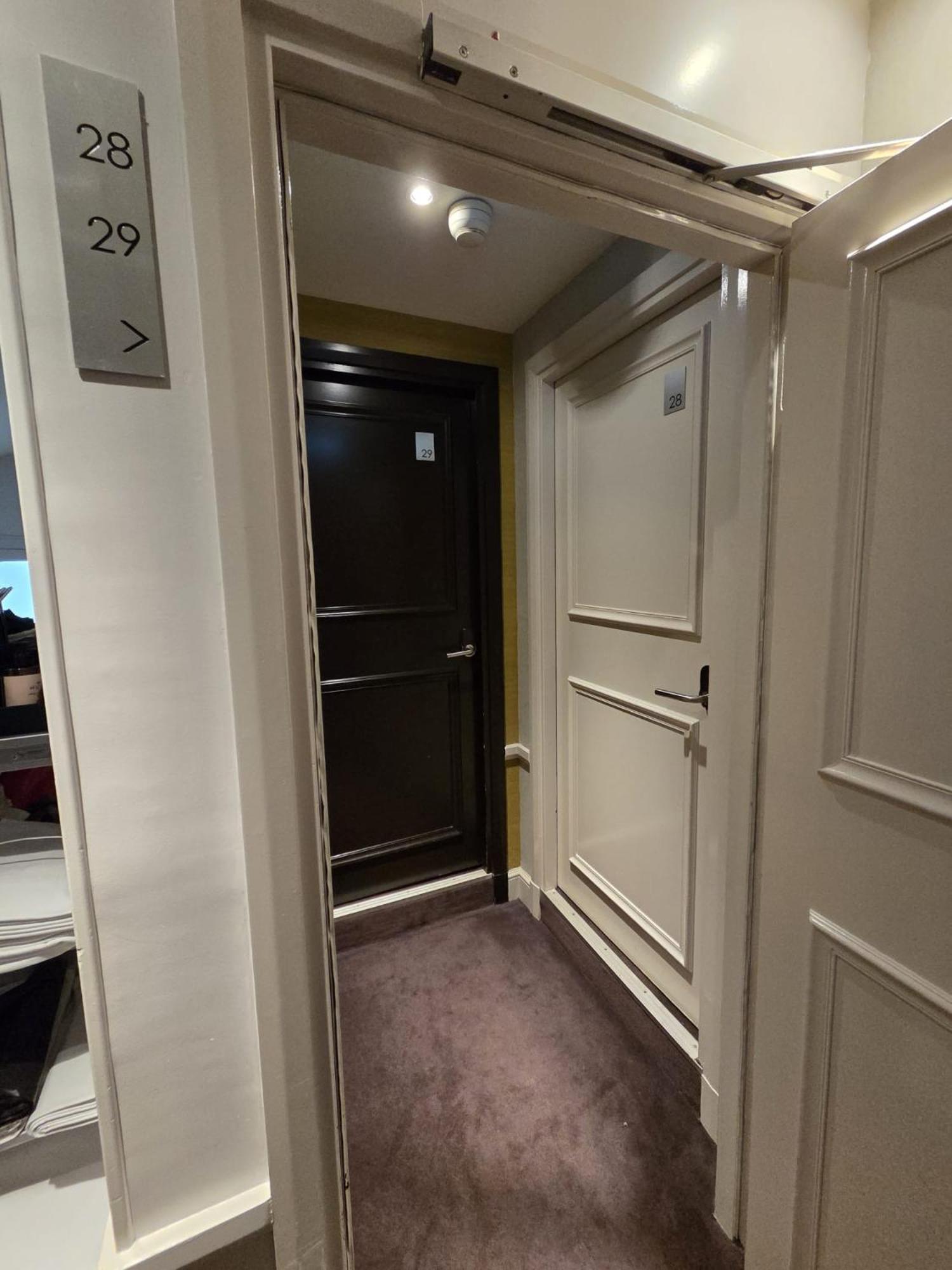 Two side-by-side rooms 52 ft² each