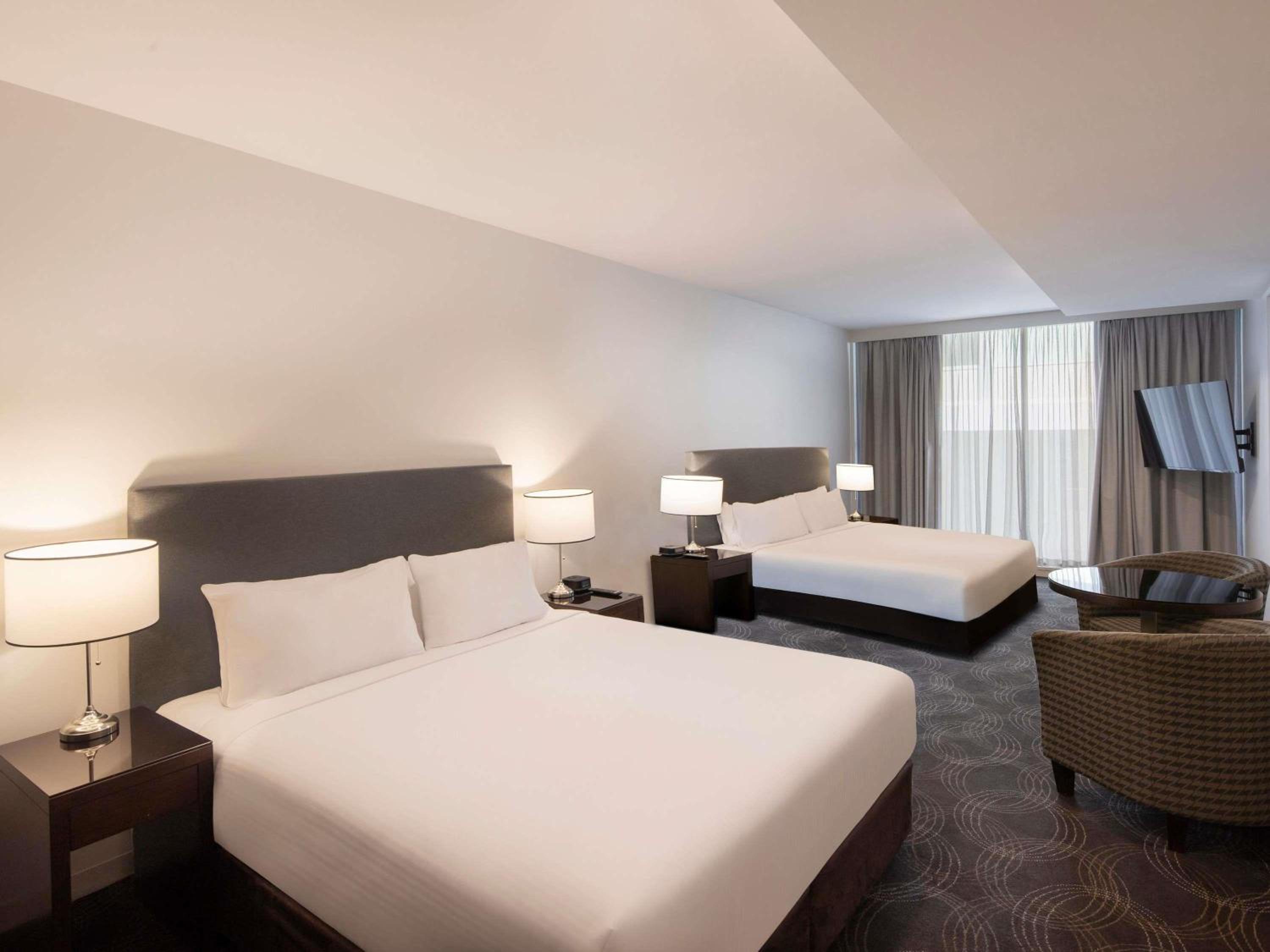 Deluxe Queen Room with Two Queen Beds - Photo 1