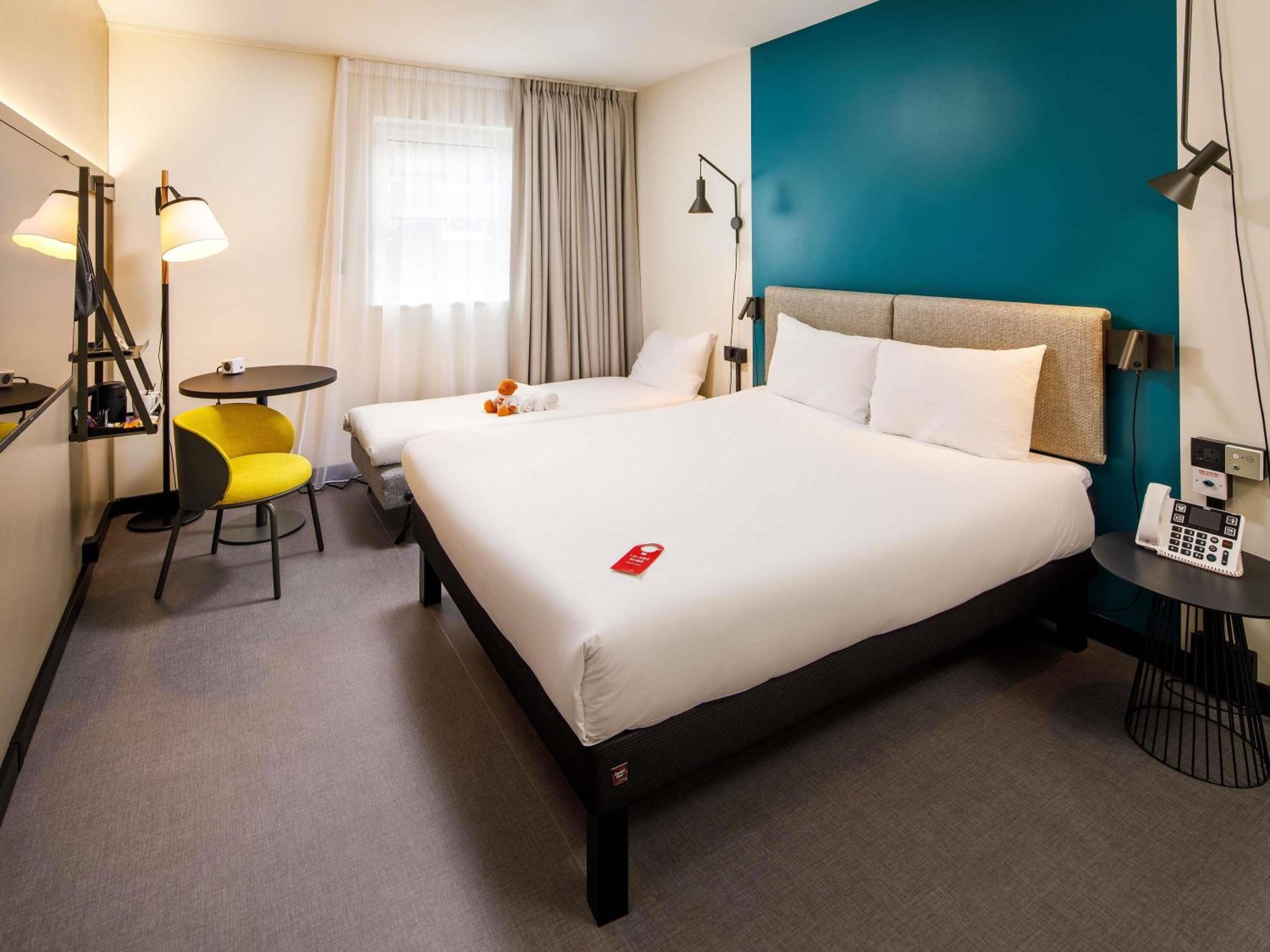 family room with one double and one single bed photo 3