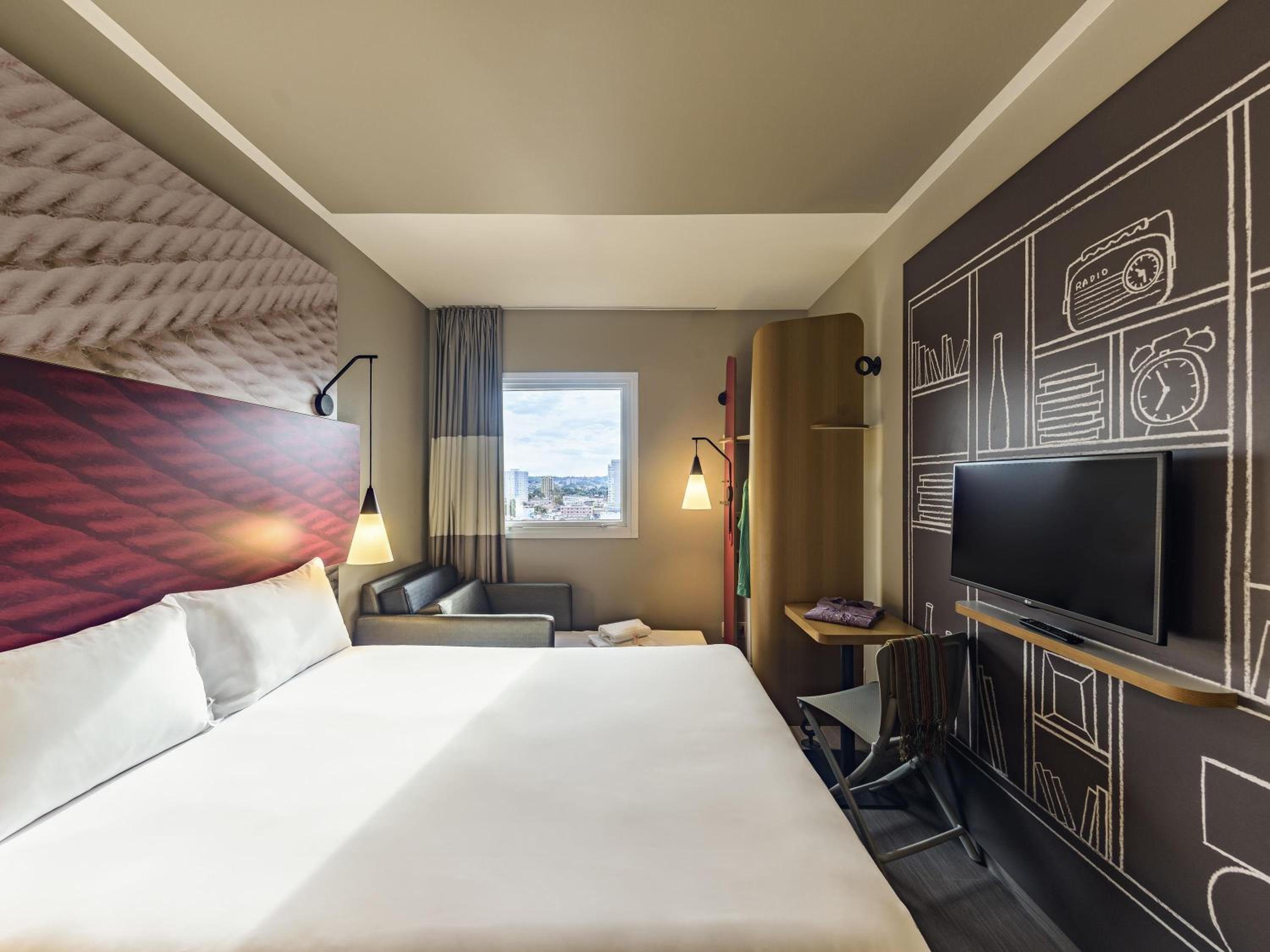 Standard Room with double bed and sofa