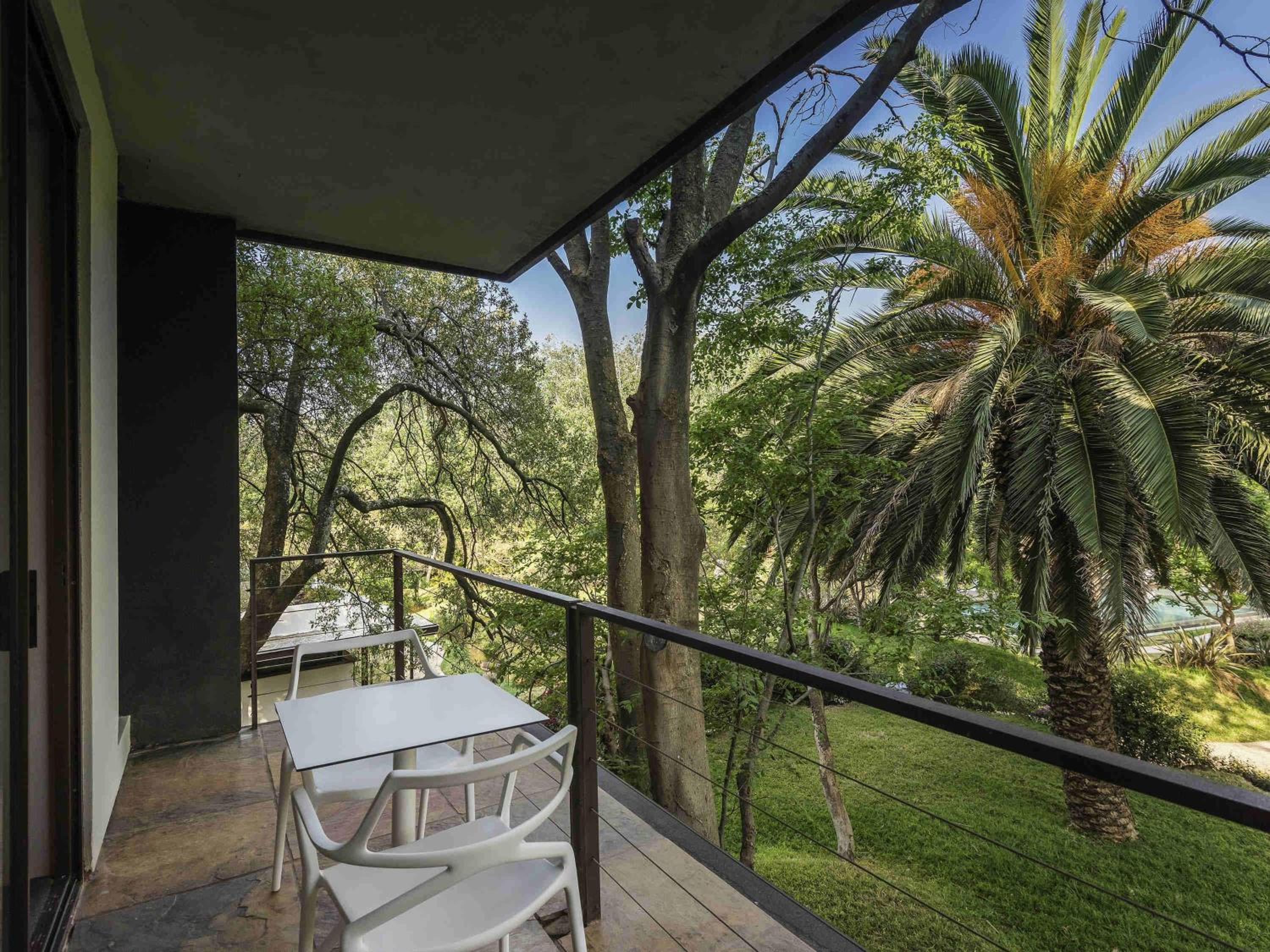 Deluxe King Suite with Garden and Pool View