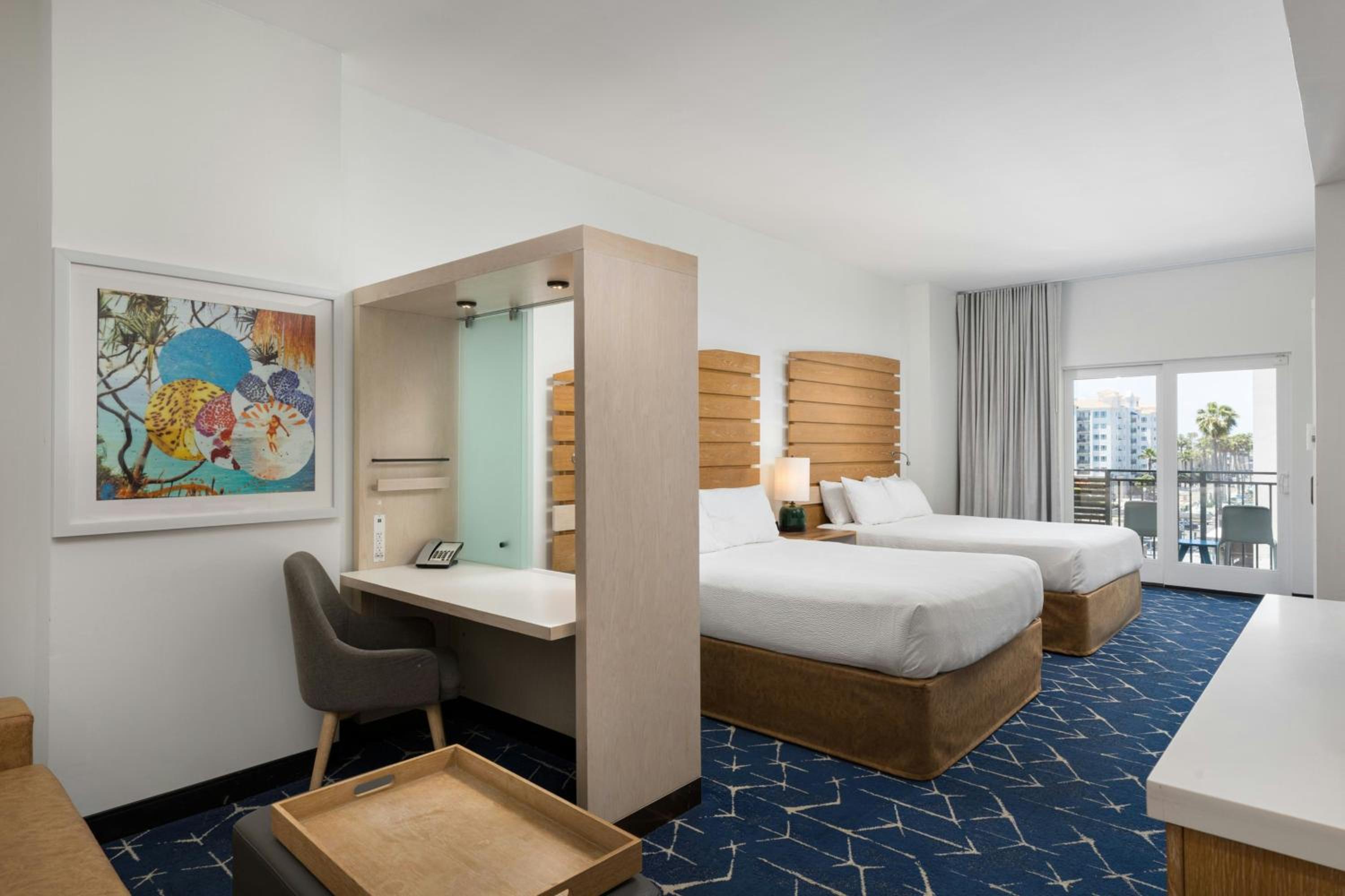 Queen Suite with Two Queen Beds, Balcony and Trundle Sofa