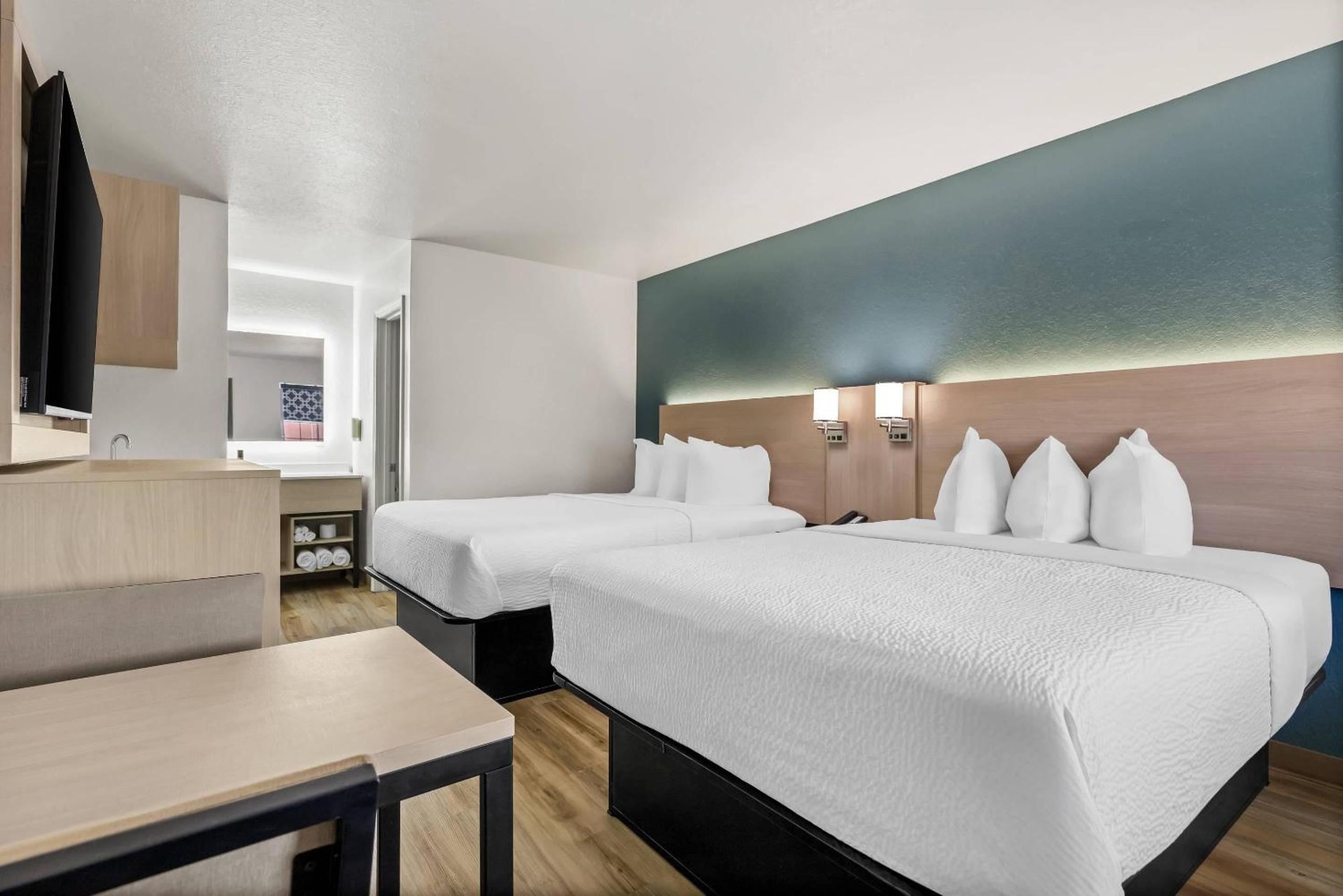 Superior Efficiency Queen Room with Two Queen Beds - Non-Smoking - Photo 1