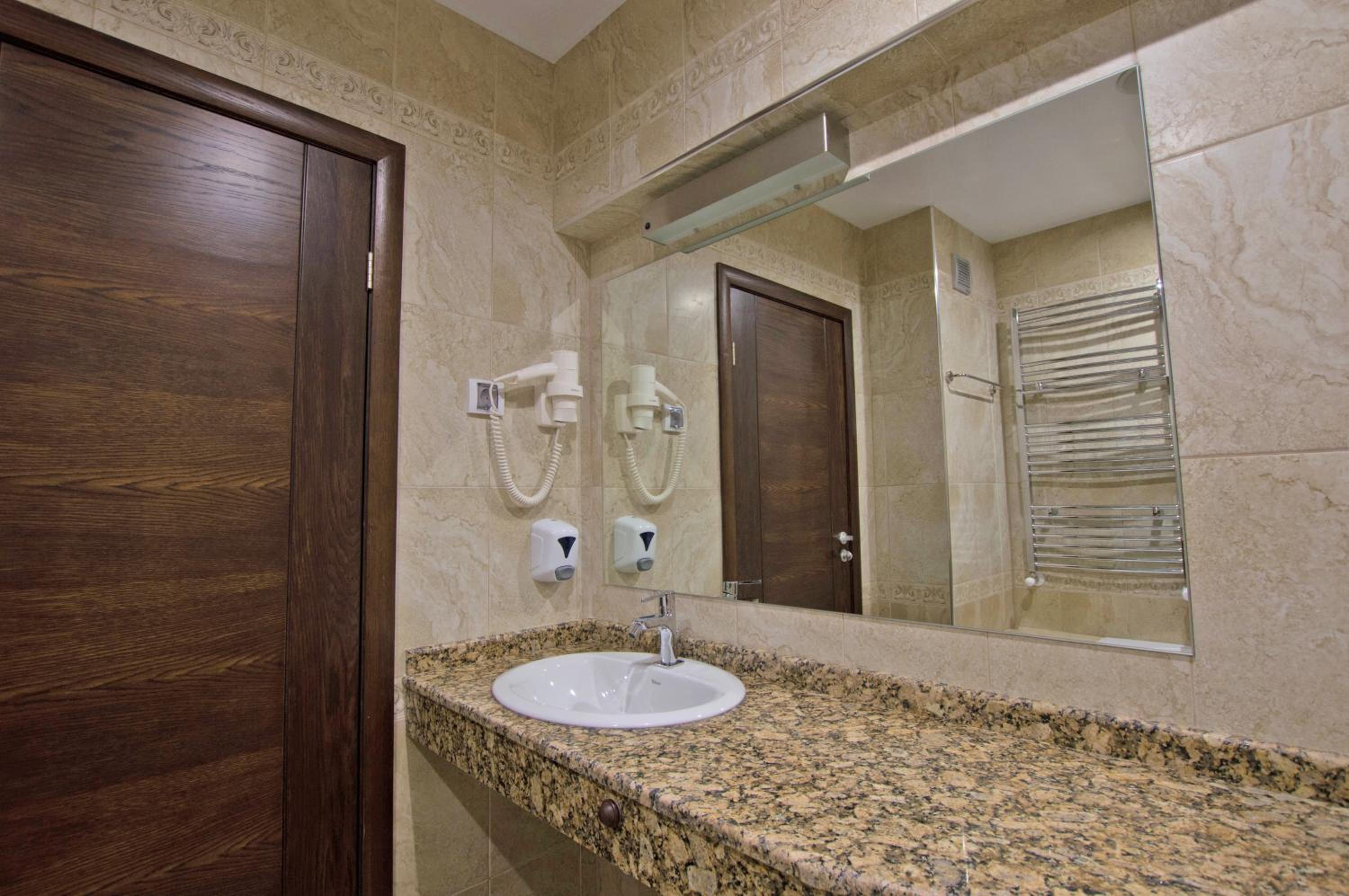 Deluxe Two-Bedroom Apartment with Balcony - Photo 16