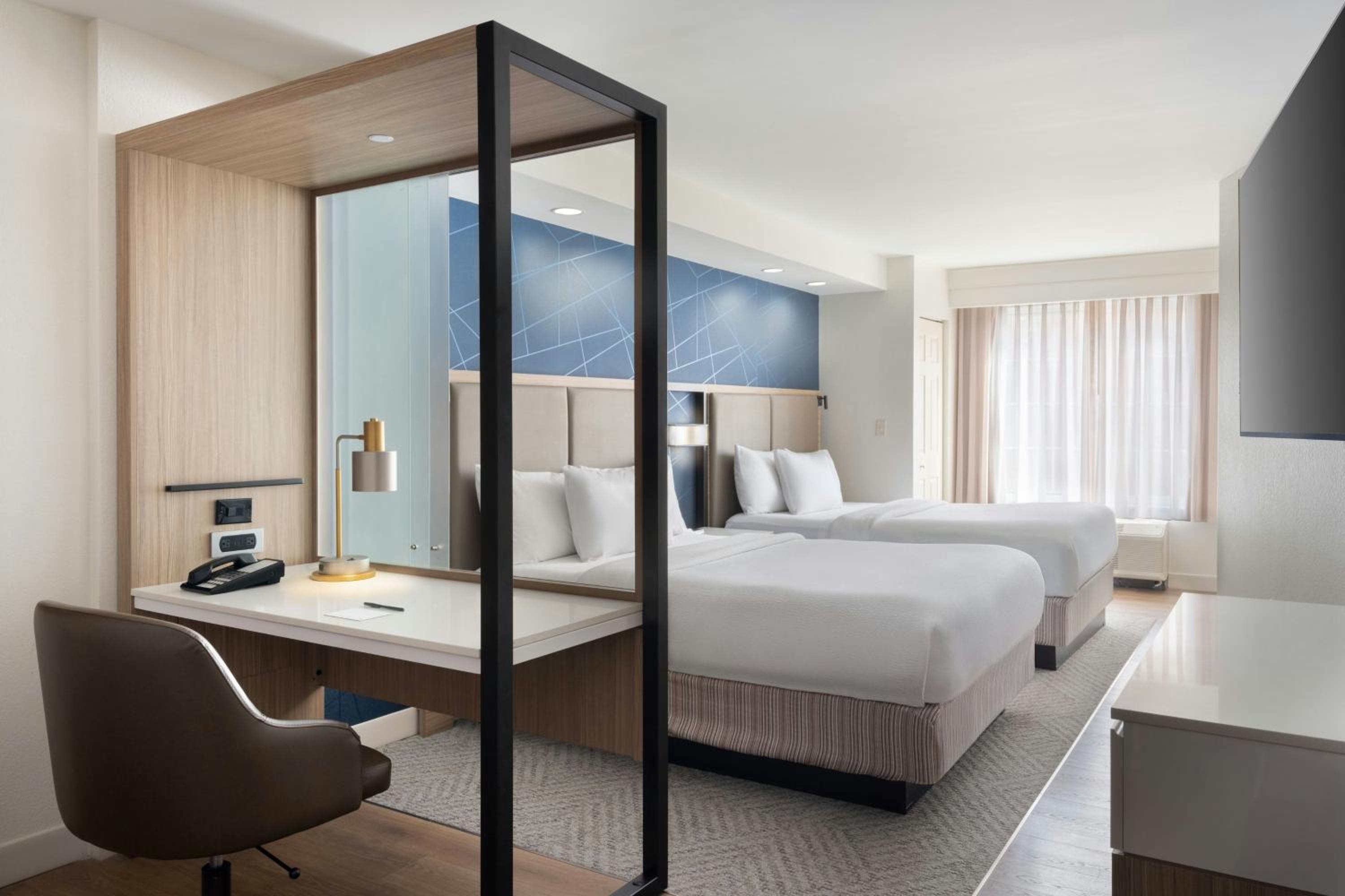 Queen Suite with Two Queen Beds and Trundle Sofa - Photo 1