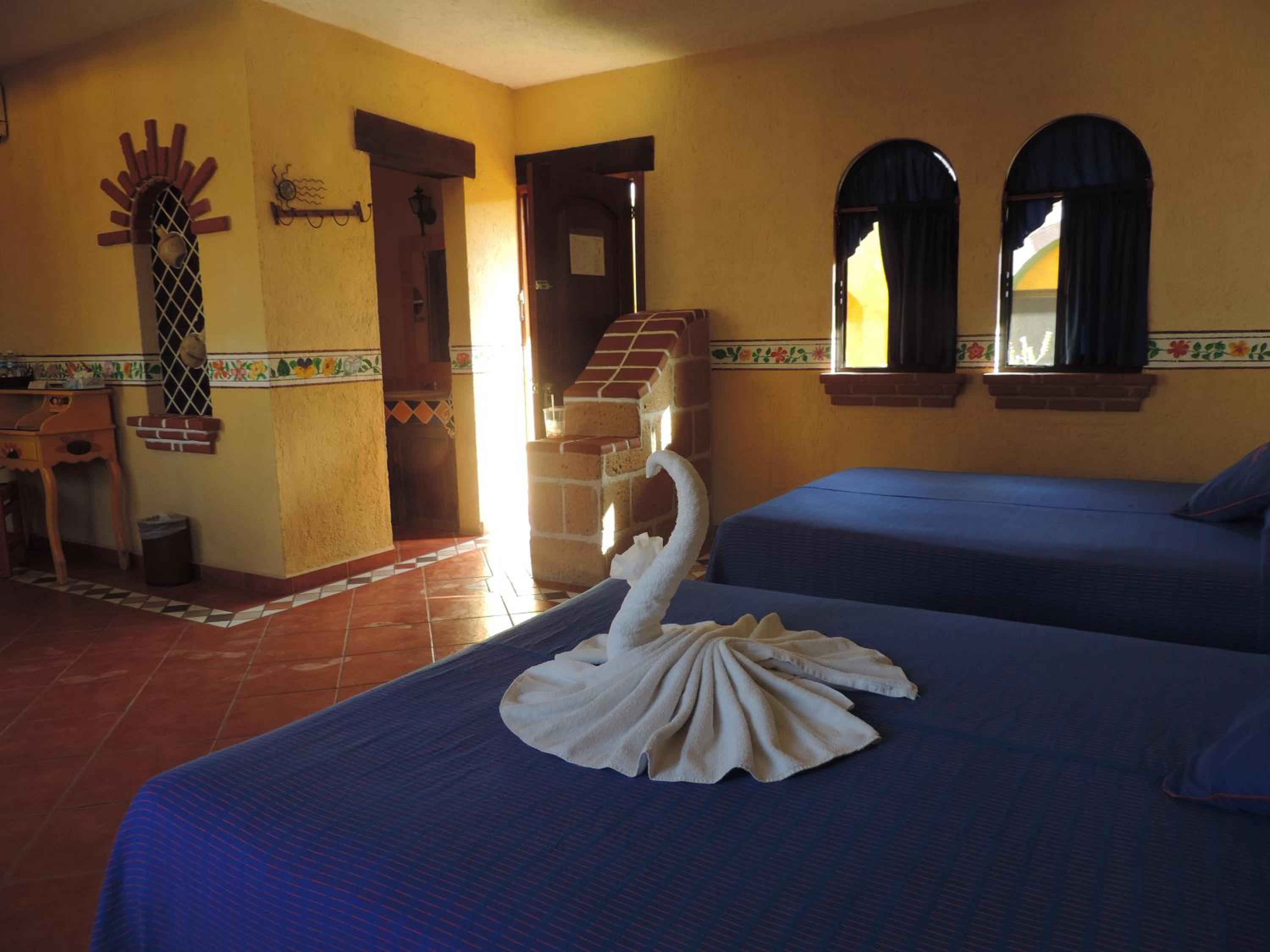 Queen Room with Two Queen Beds - Photo 1