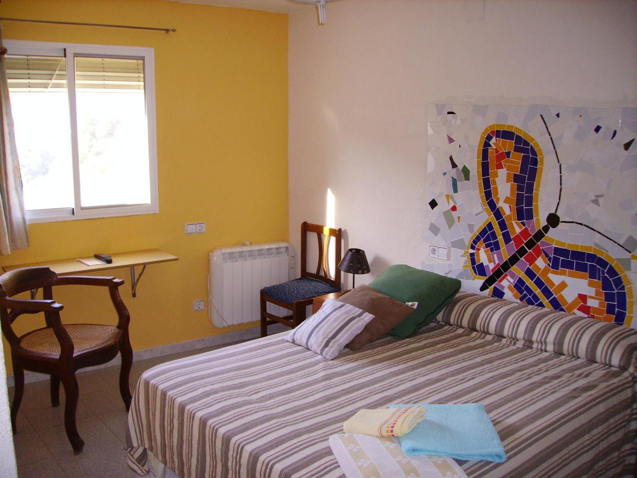Habitación Cuádruple con Vista al Jardín