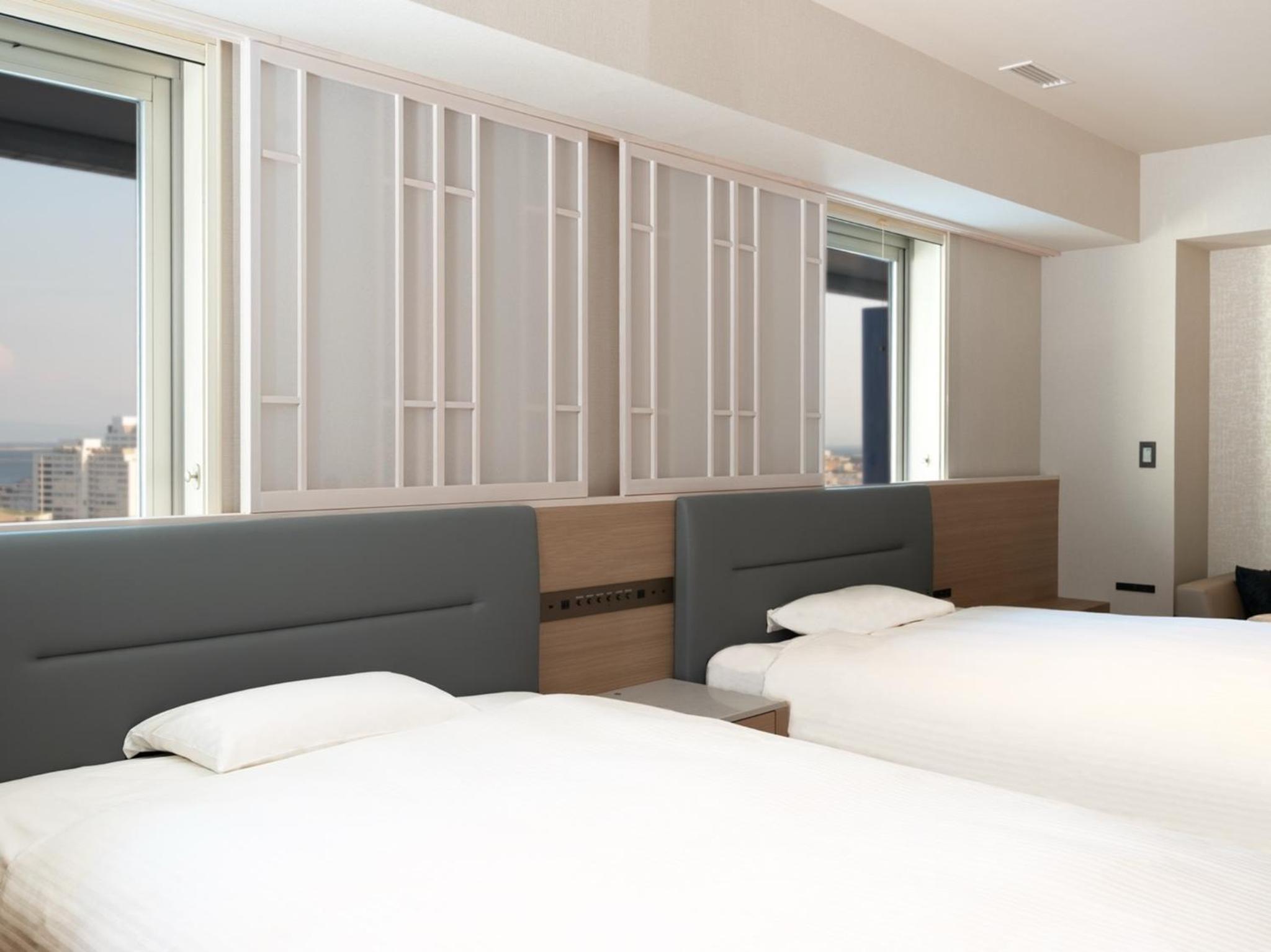 Deluxe Twin Room with Two Double Beds - Photo 1