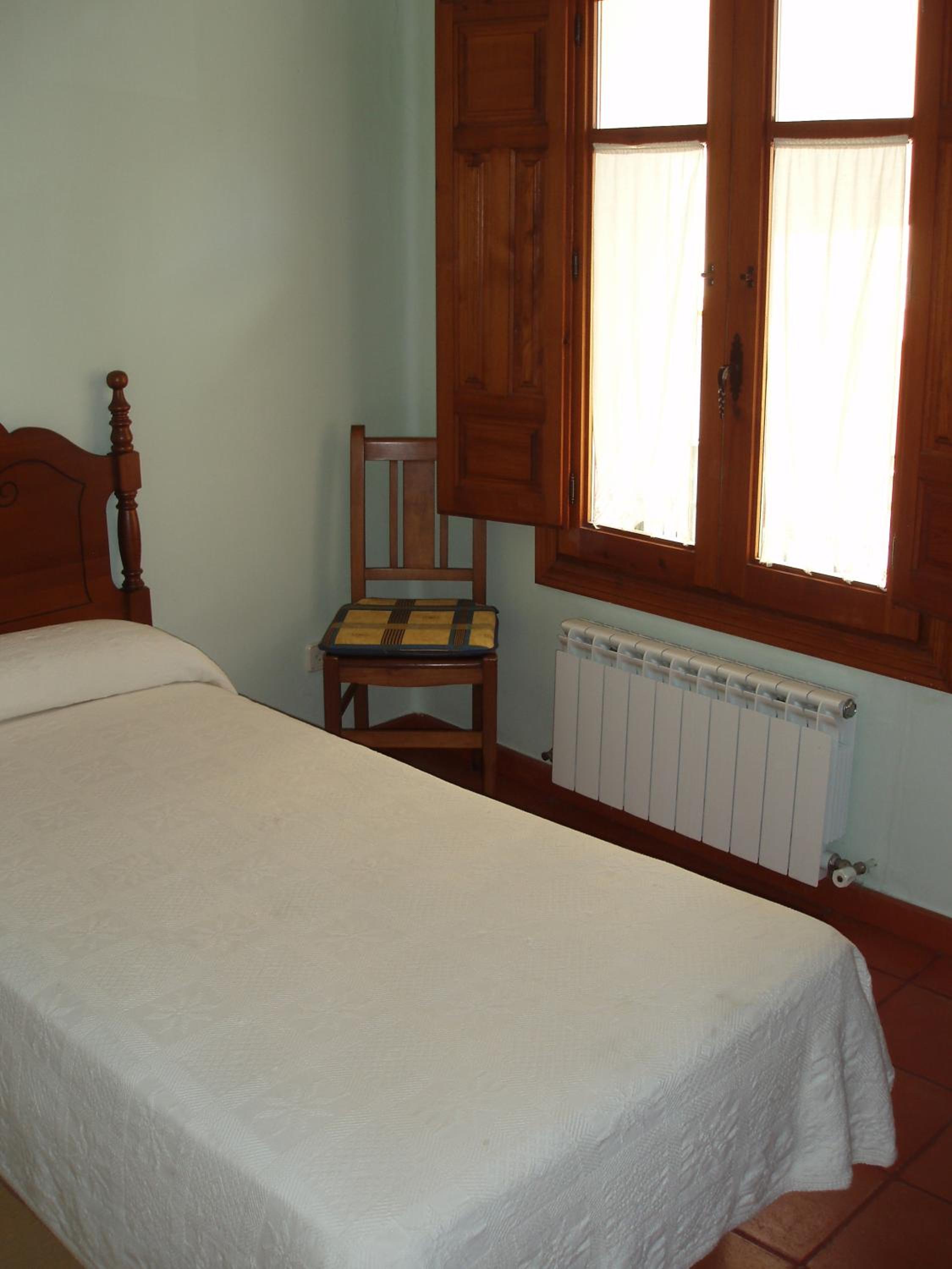 Habitación individual con baño compartido