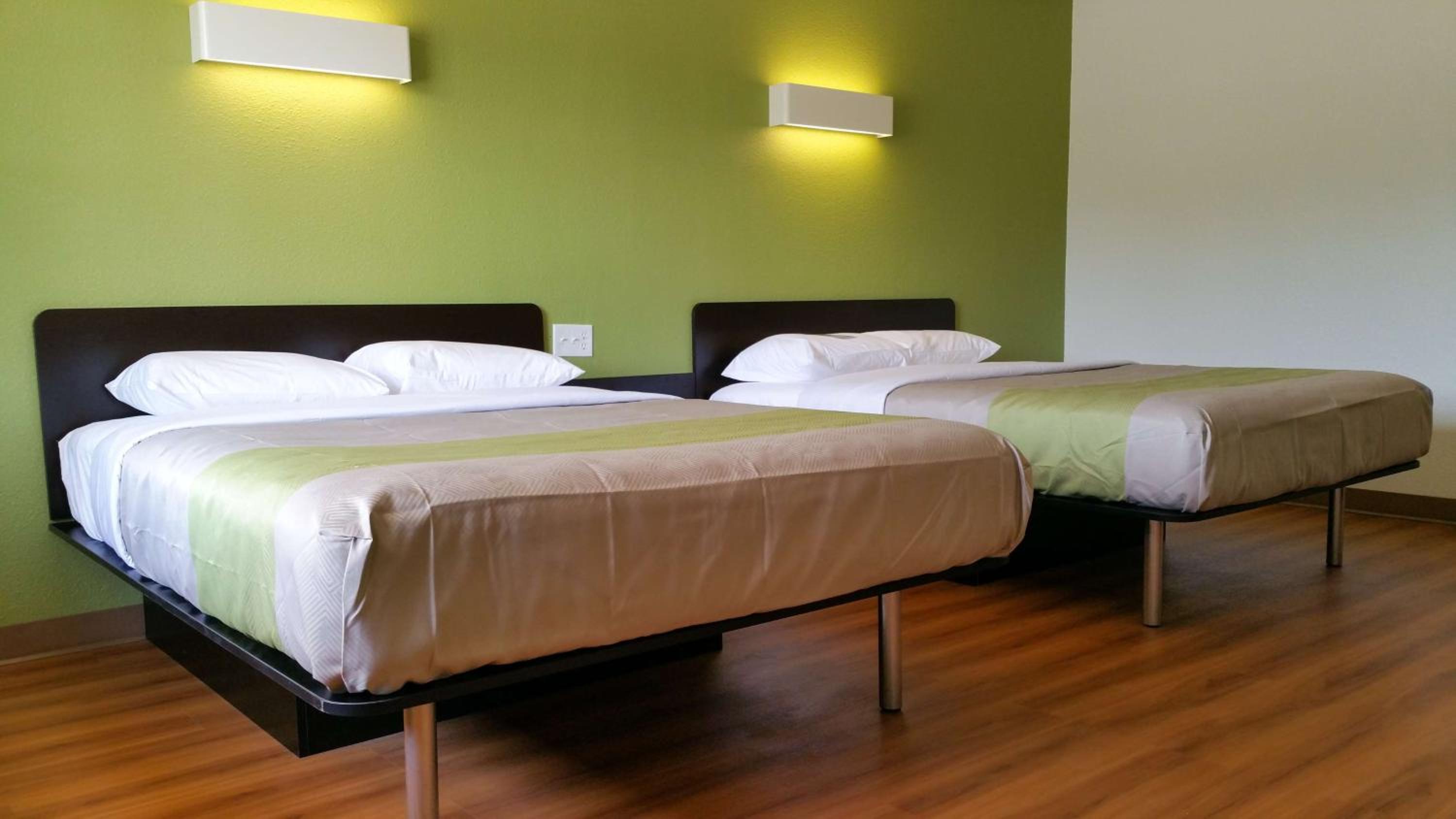 Deluxe Queen Room with Two Queen Beds - Smoking - Photo 1