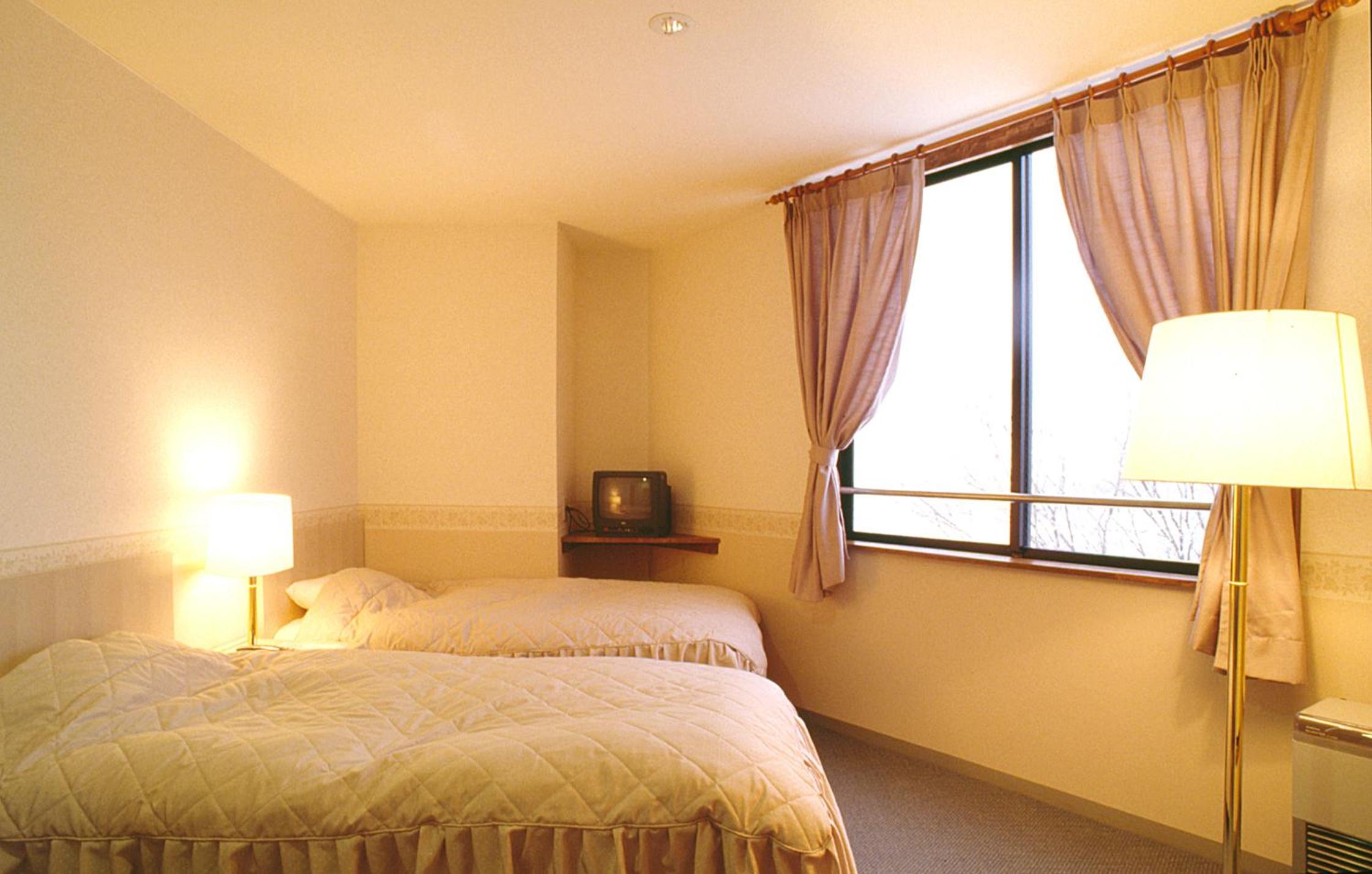 Twin Room with Private Bathroom and Toilet photo 1