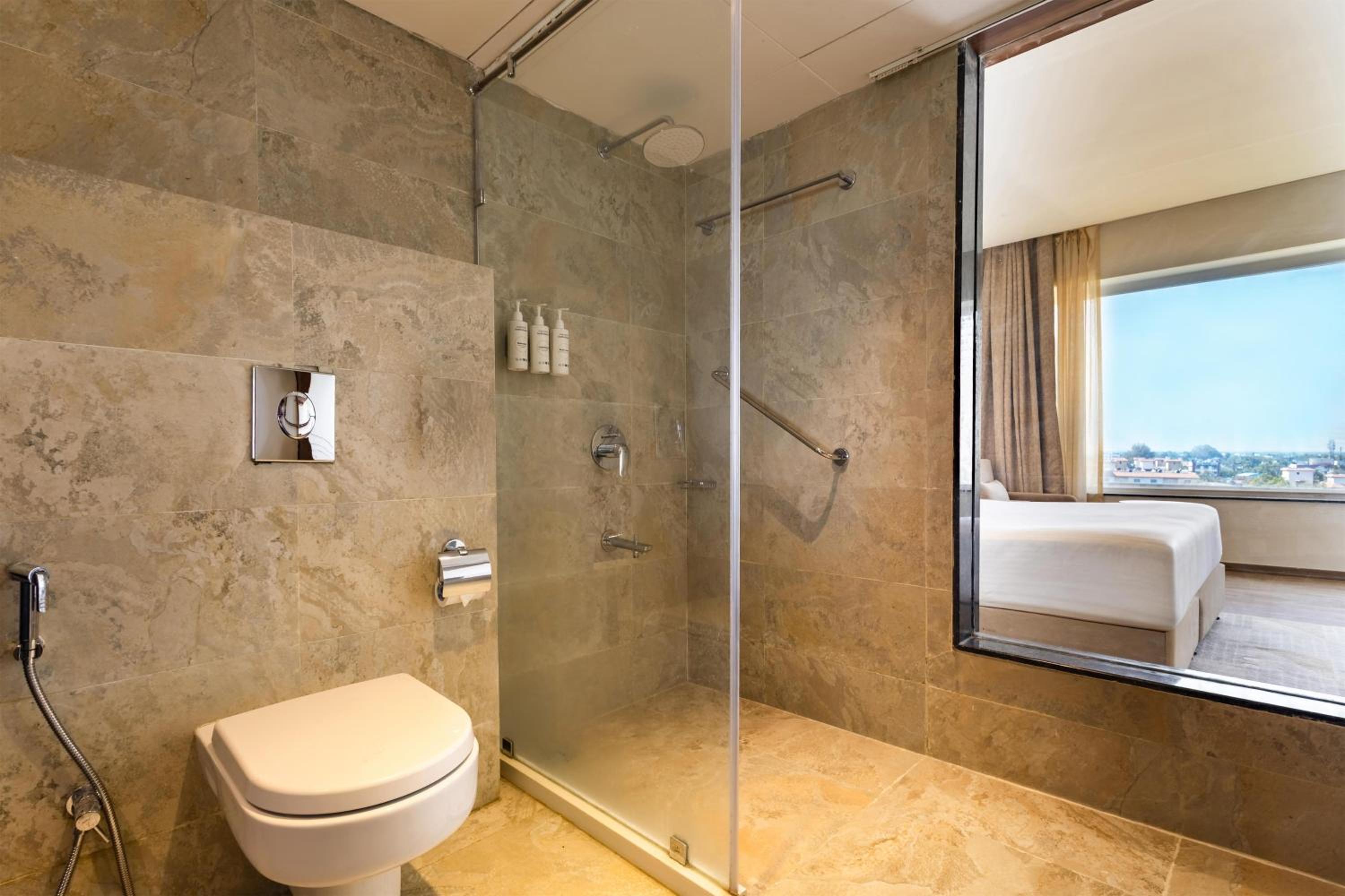 Deluxe Room with Complimentary Shuttle Pickup and Drop to Sai Baba Temple and Guaranteed early check in and late Check out upto 3 hours (Subject to availability) photo 3