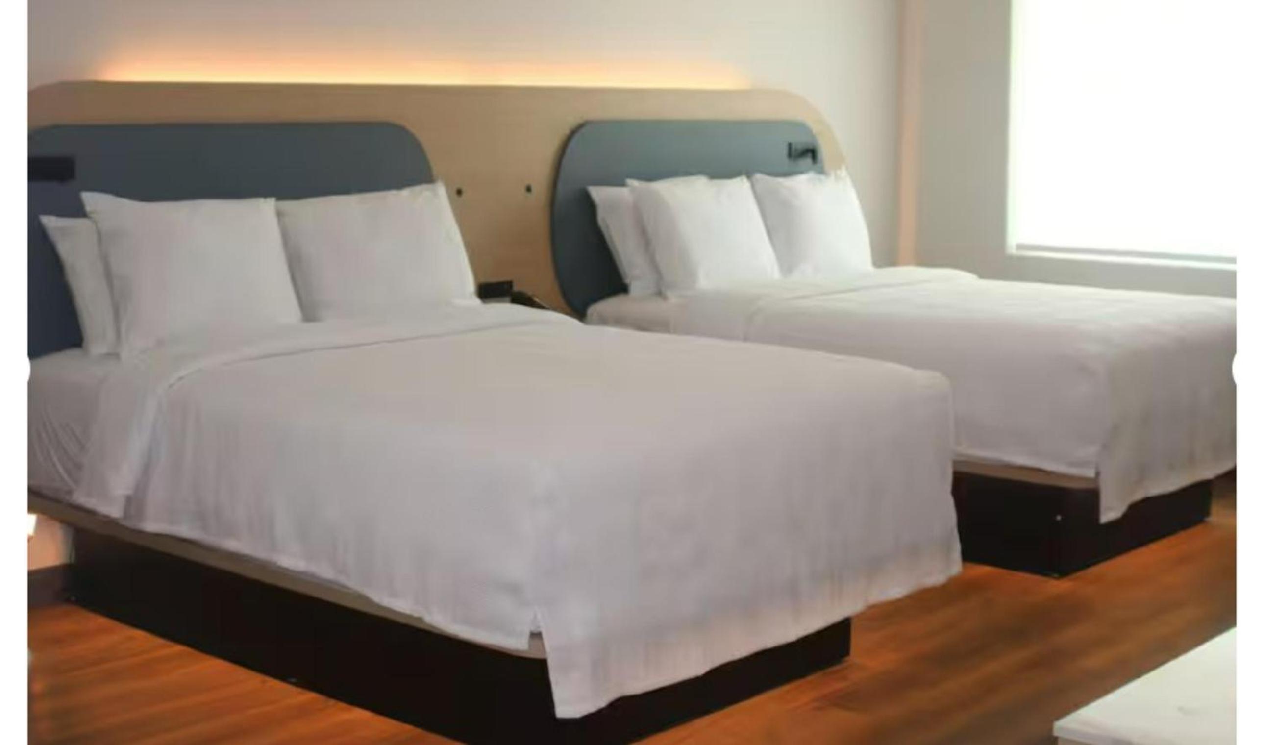Premium Kitchenette Room with Two Queen Beds and Balcony - Photo 2