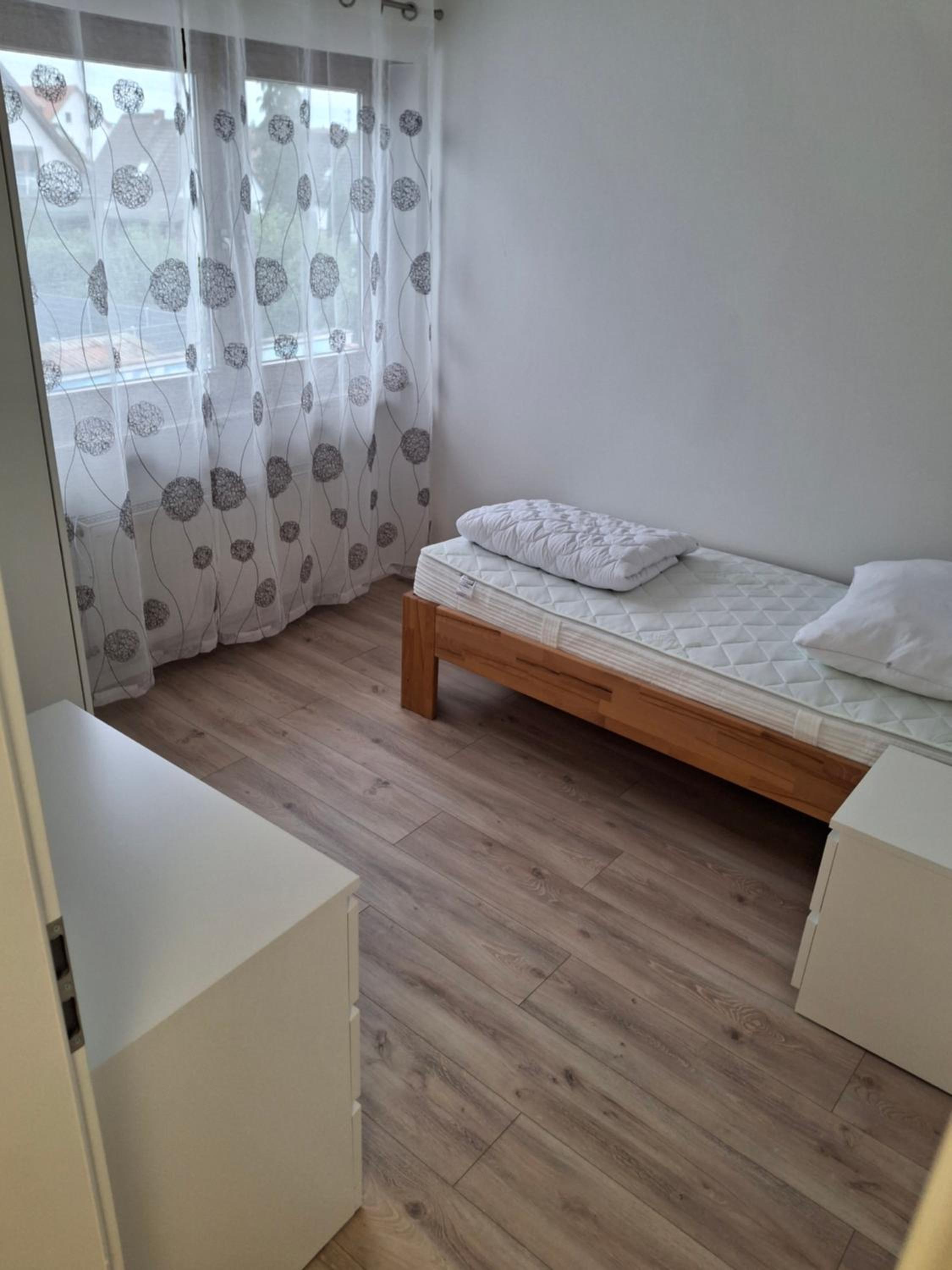 Three-Bedroom Apartment with Balcony photo 2