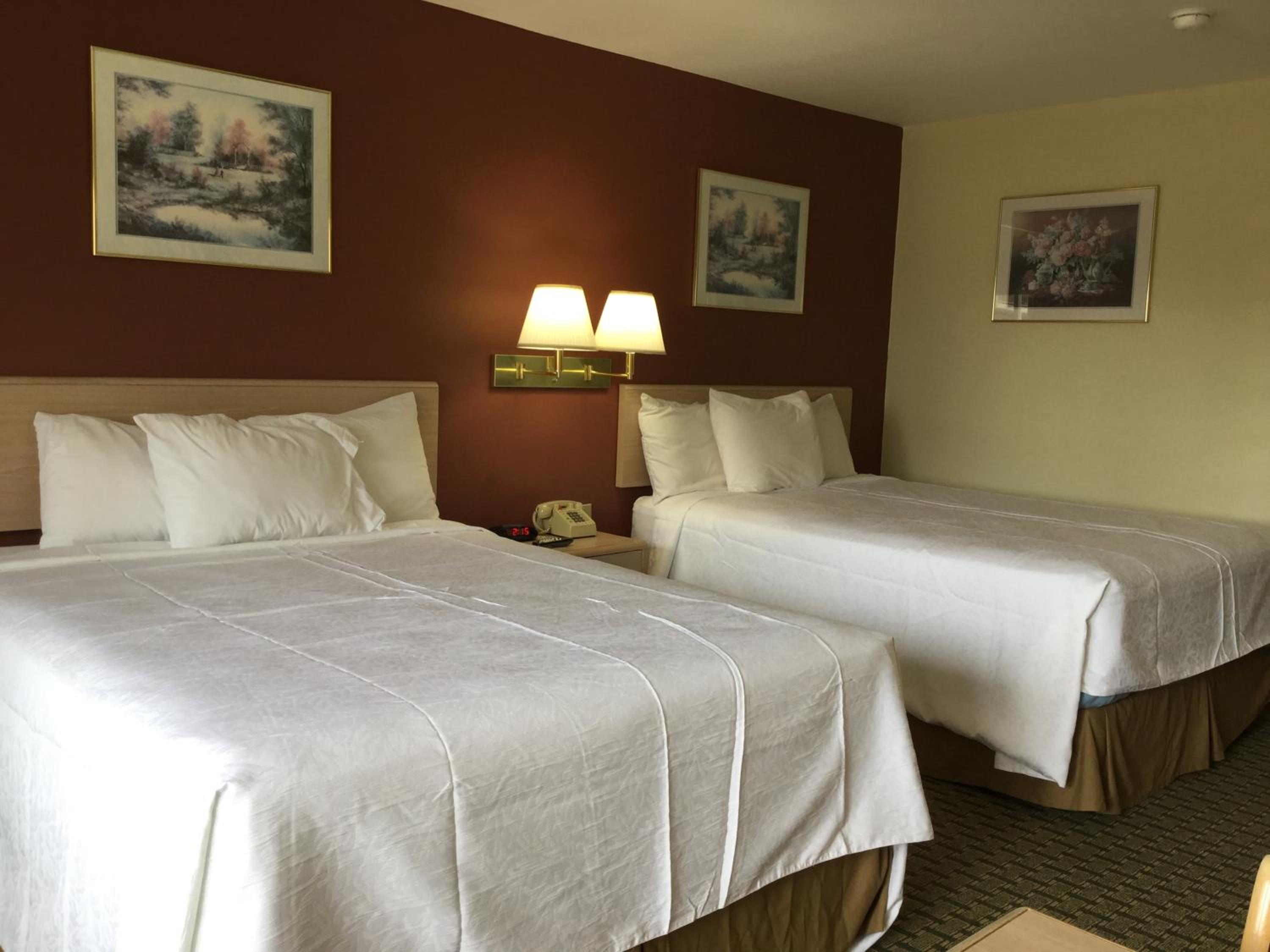 Queen Room with Two Queen Beds - Smoking - Photo 1