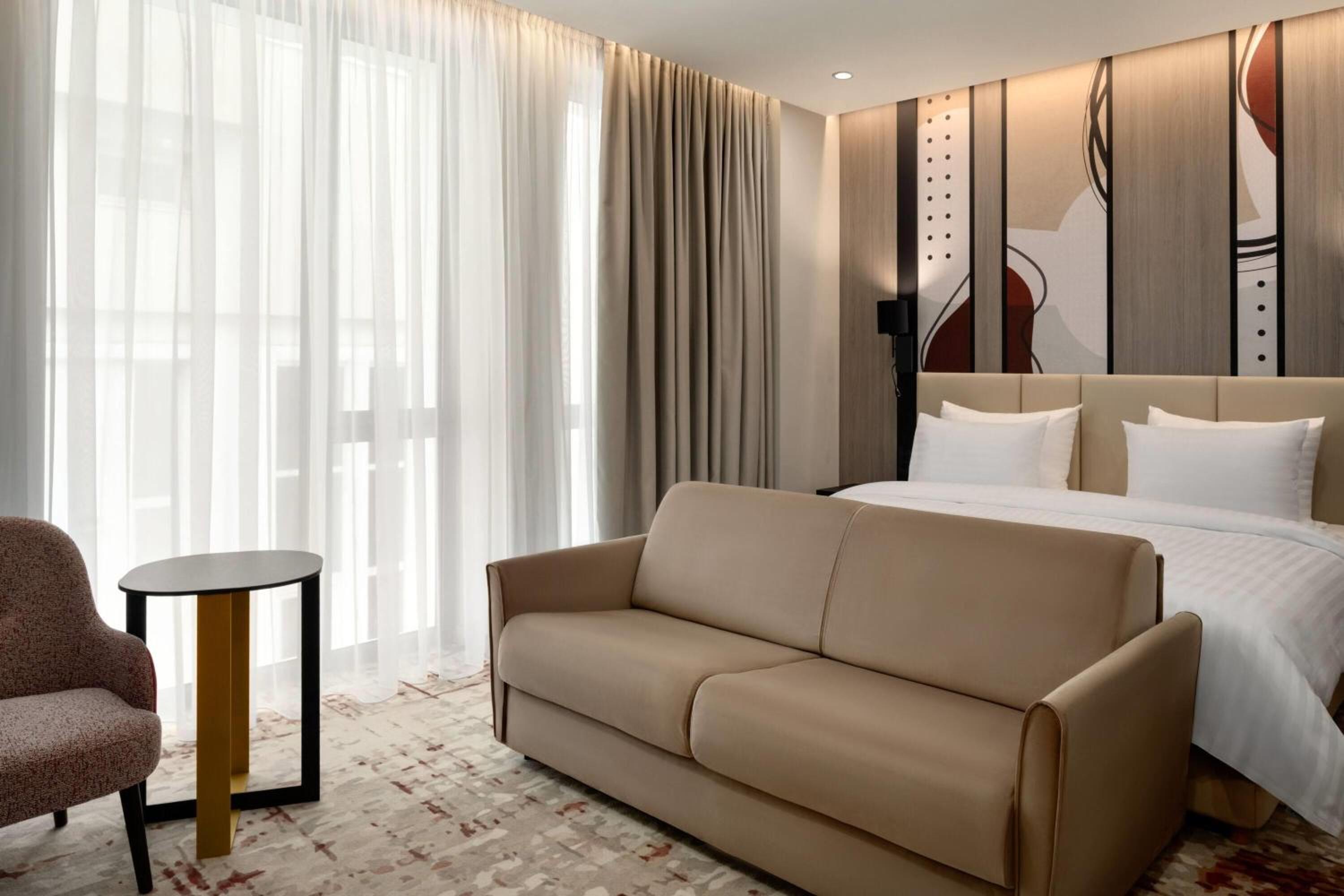 Deluxe King Room with Sofa Bed photo 1