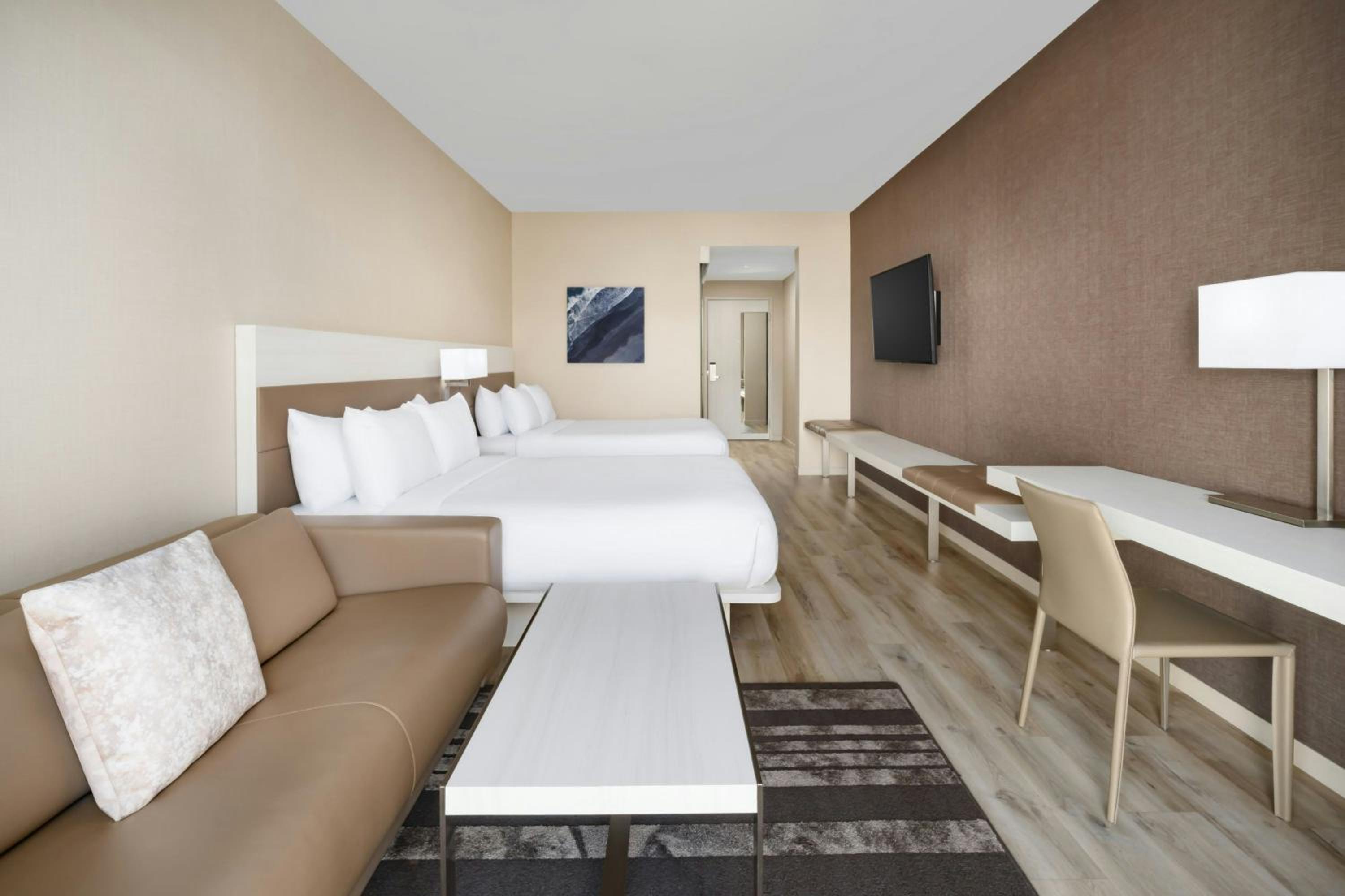 Queen Room with Two Queen Beds and Sofa Bed - Hearing Accessible photo 1