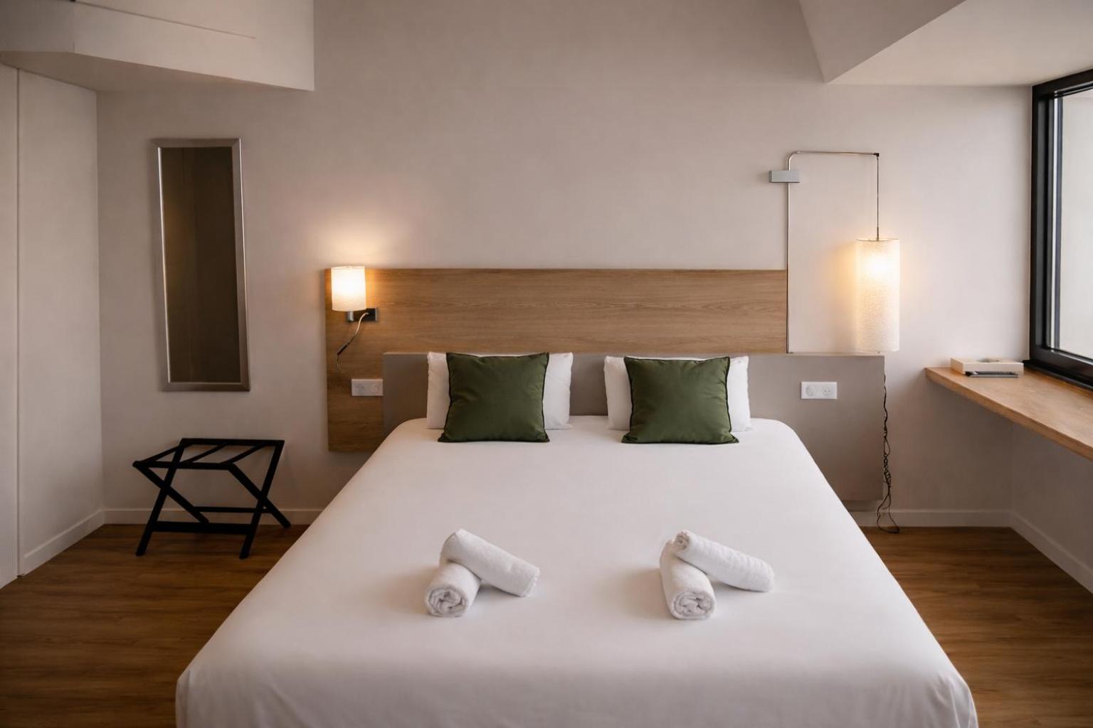 Family Room with One Queen Bed and Two Single Beds - Non-Smoking  - Photo 1