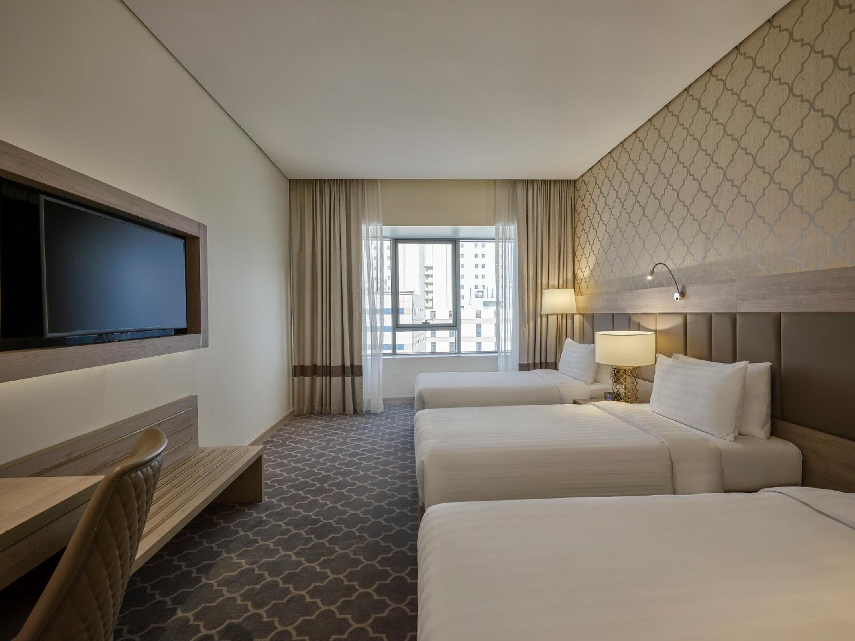 Triple Deluxe Room with City view