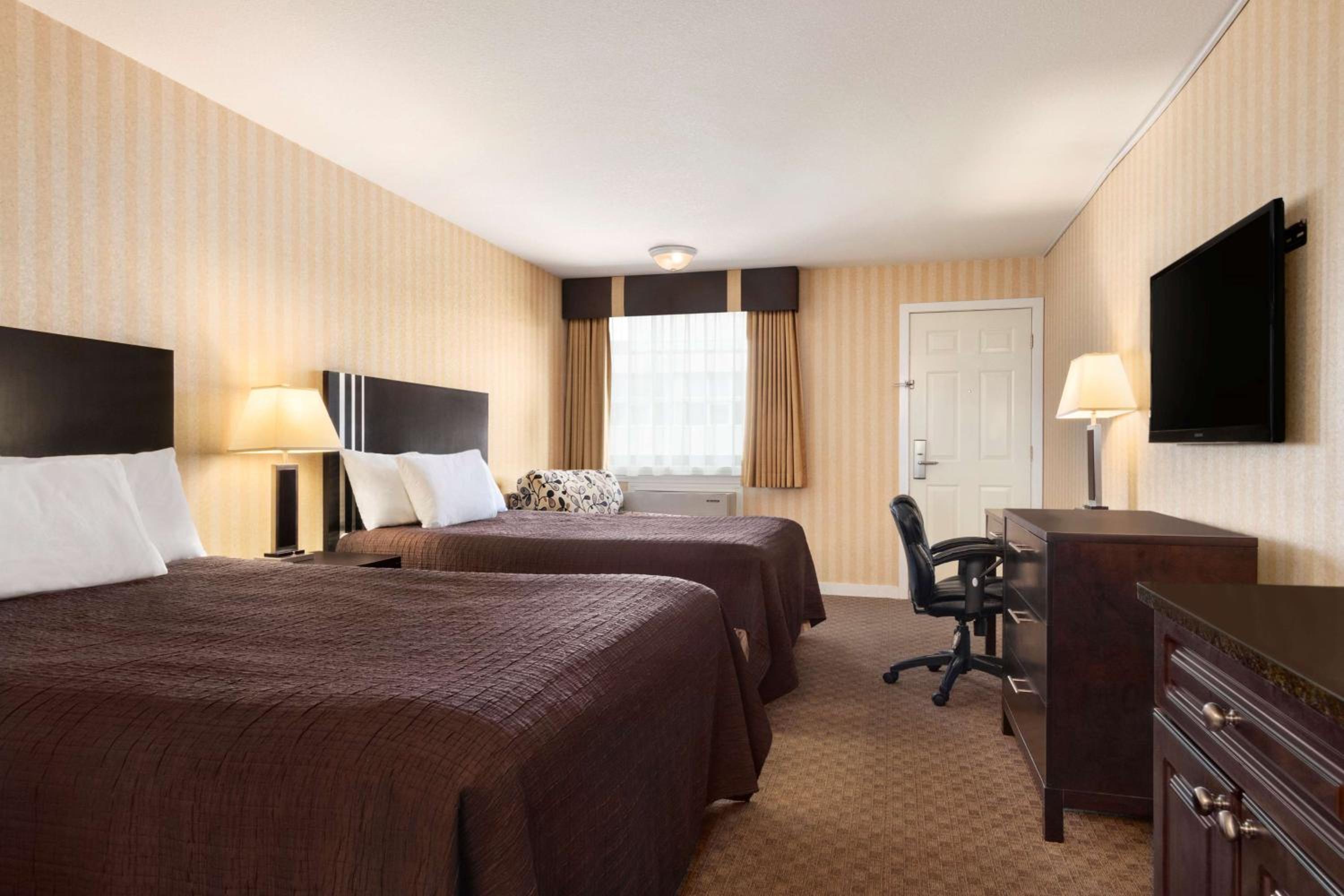 Queen Room with Two Queen Beds - Photo 1