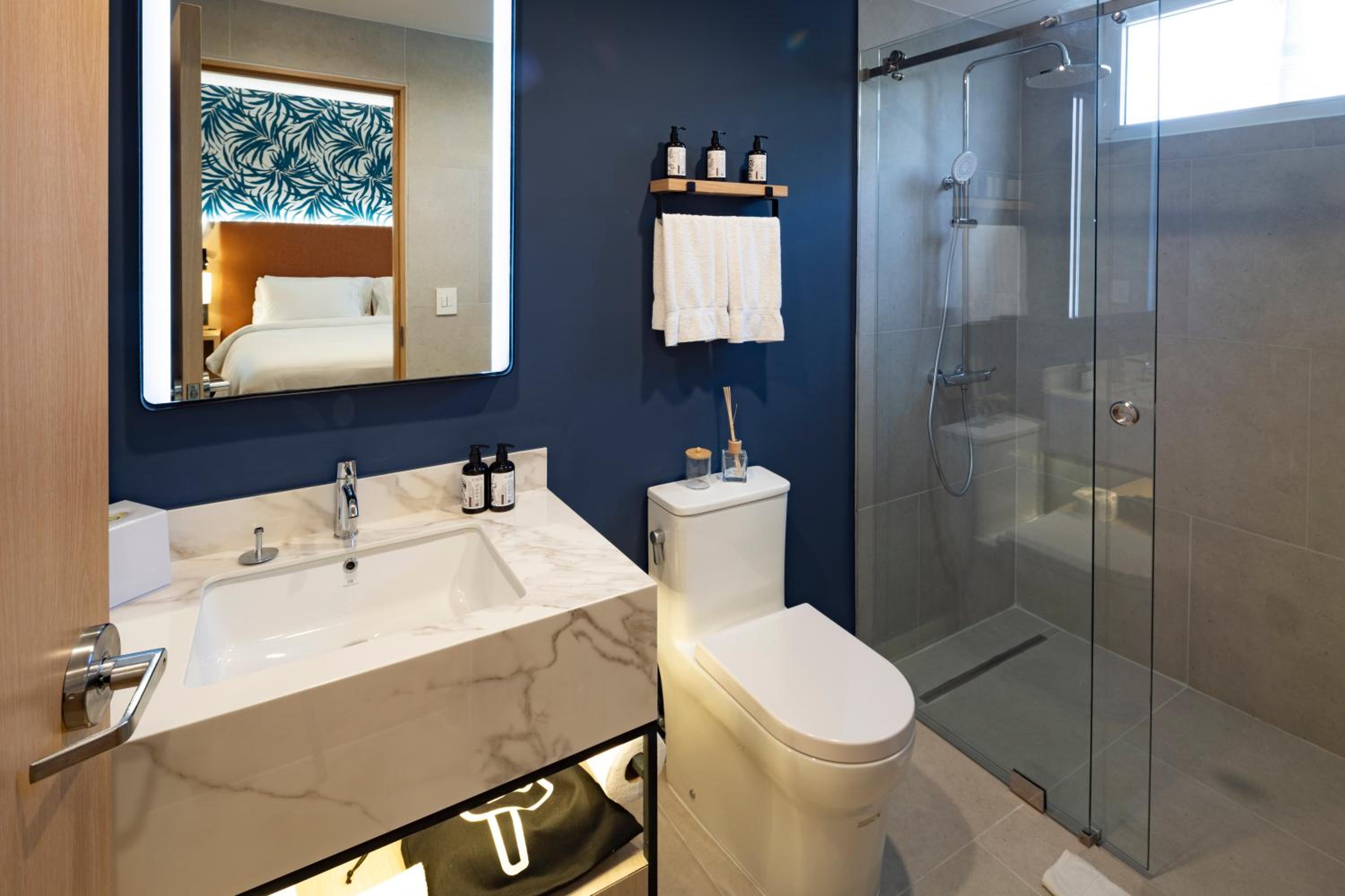 Premium Queen Room with Two Queen Beds - Photo 1