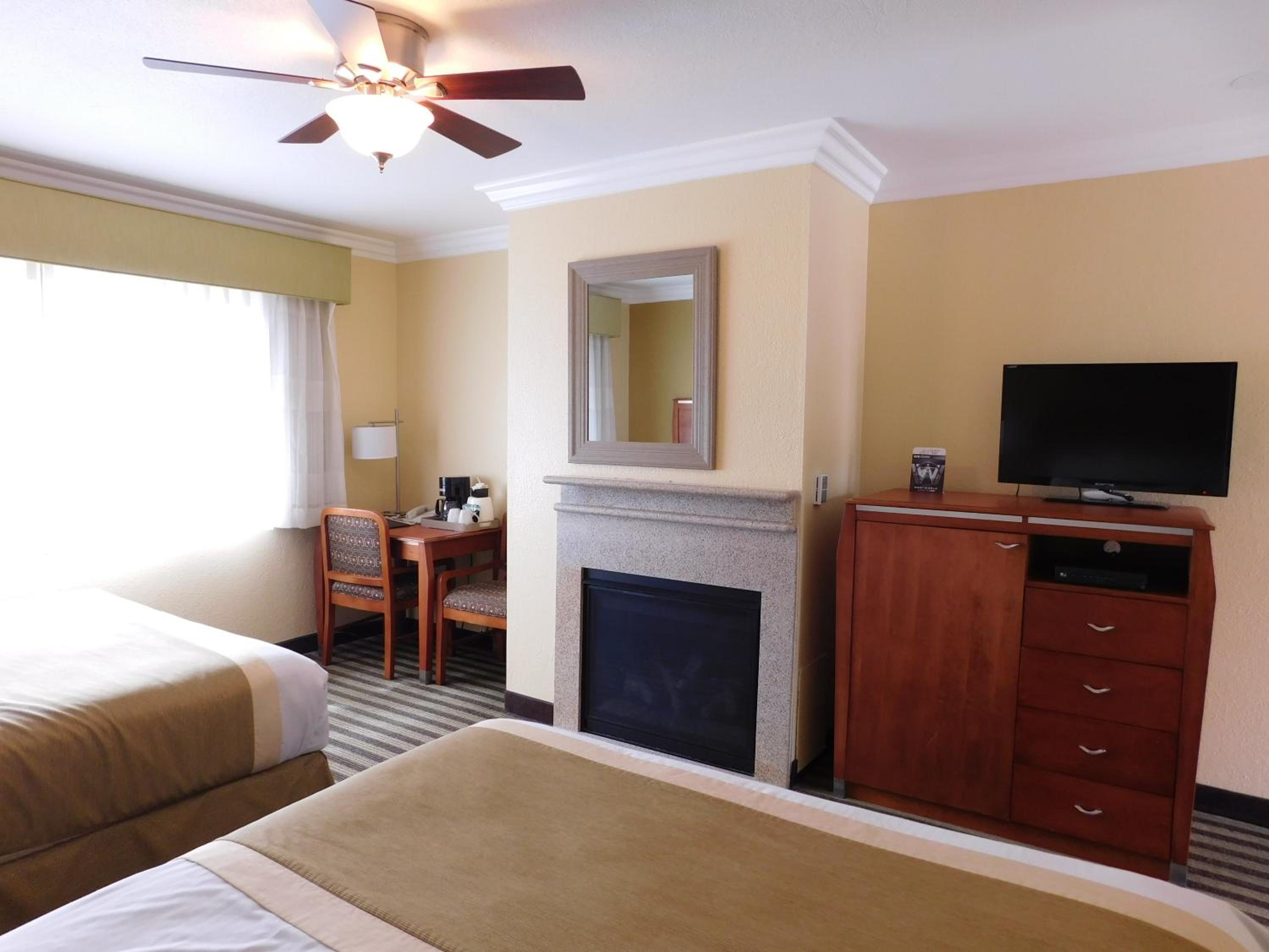 Queen Room with Two Queen Beds and Fireplace - Photo 1