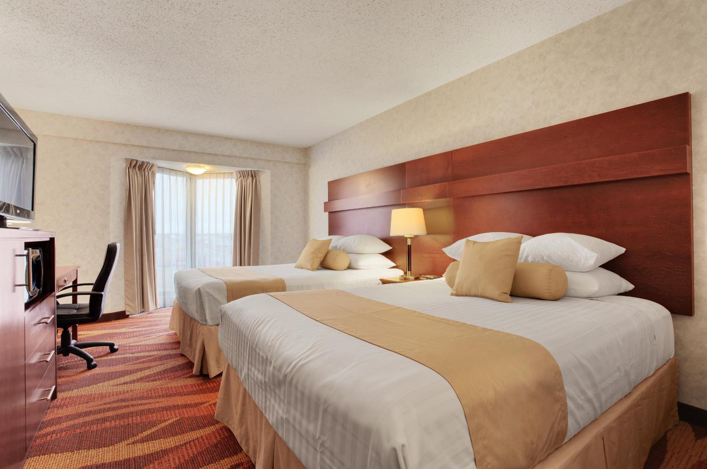 Queen Room with Two Queen Beds - Smoking - Photo 1