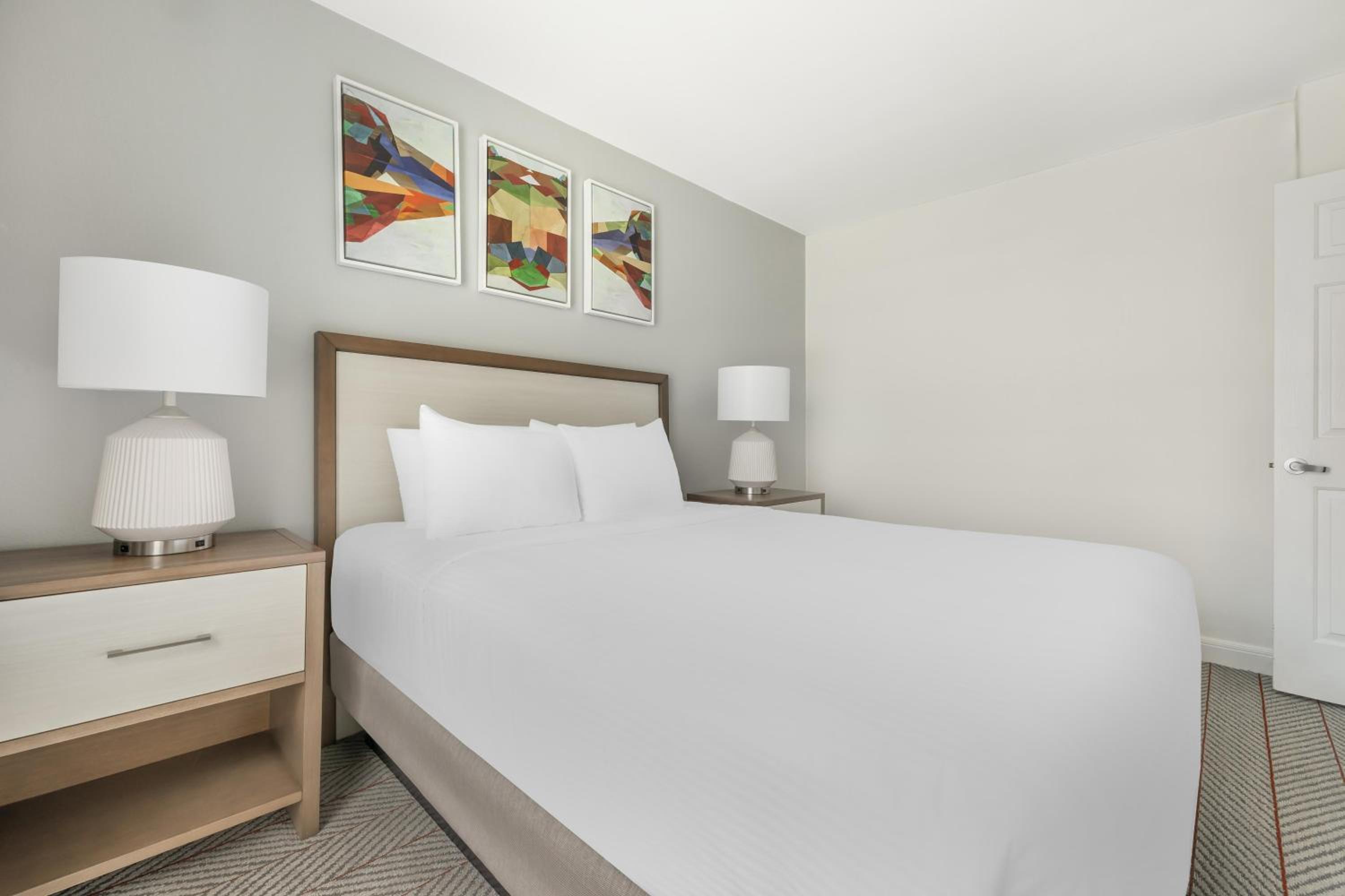 Two-Bedroom Suite with One King Bed, One Queen Bed, and Roll-In Shower