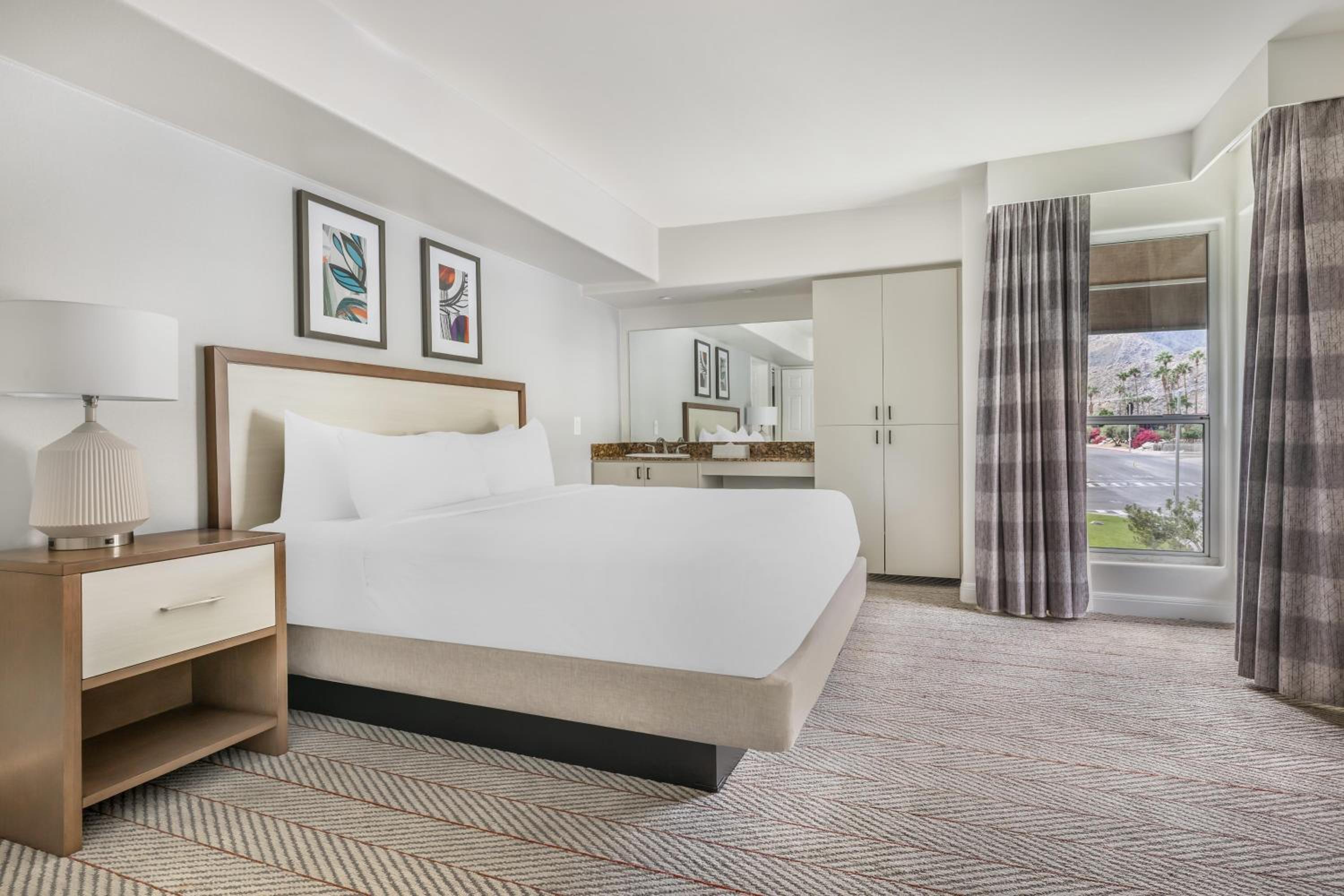 Two-Bedroom Suite with One King Bed, One Queen Bed, and Roll-In Shower