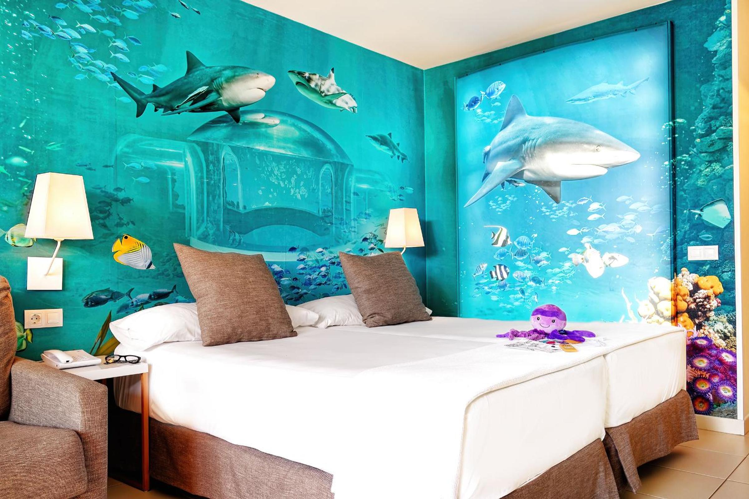 Double room pool view with entrance to Poema del Mar Aquarium ( 2 Adults + 1 Child)