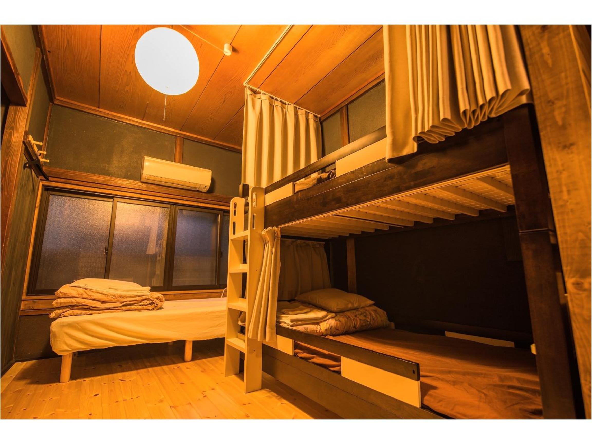 Bed in Japanese-Style Male Dormitory Room photo 1