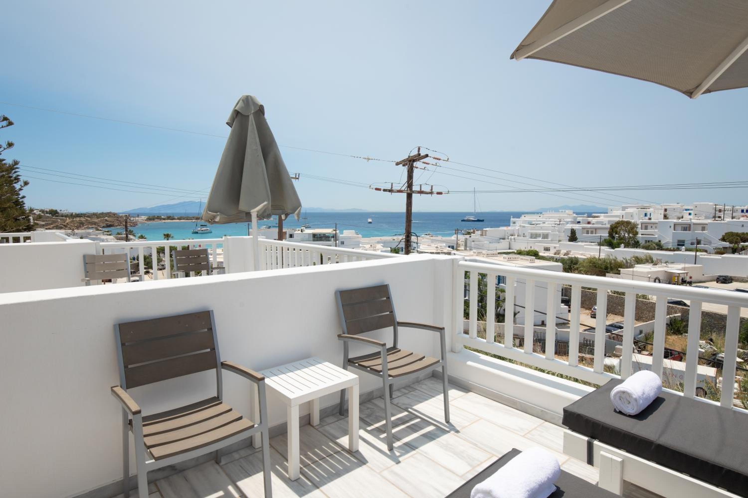 Deluxe Triple Room with Side Sea View - Photo 1