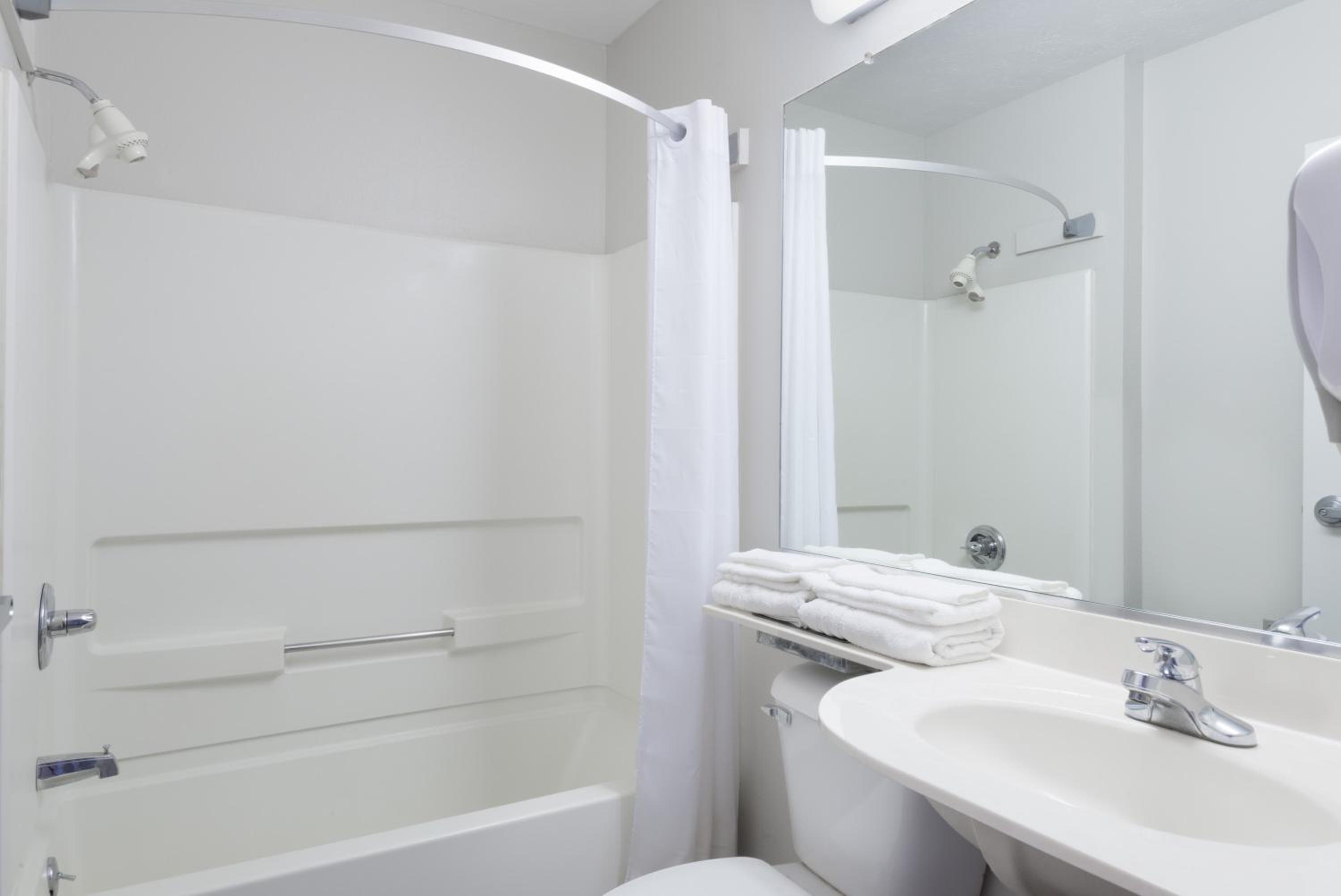 bathroom with a sink, toilet, and bathtub