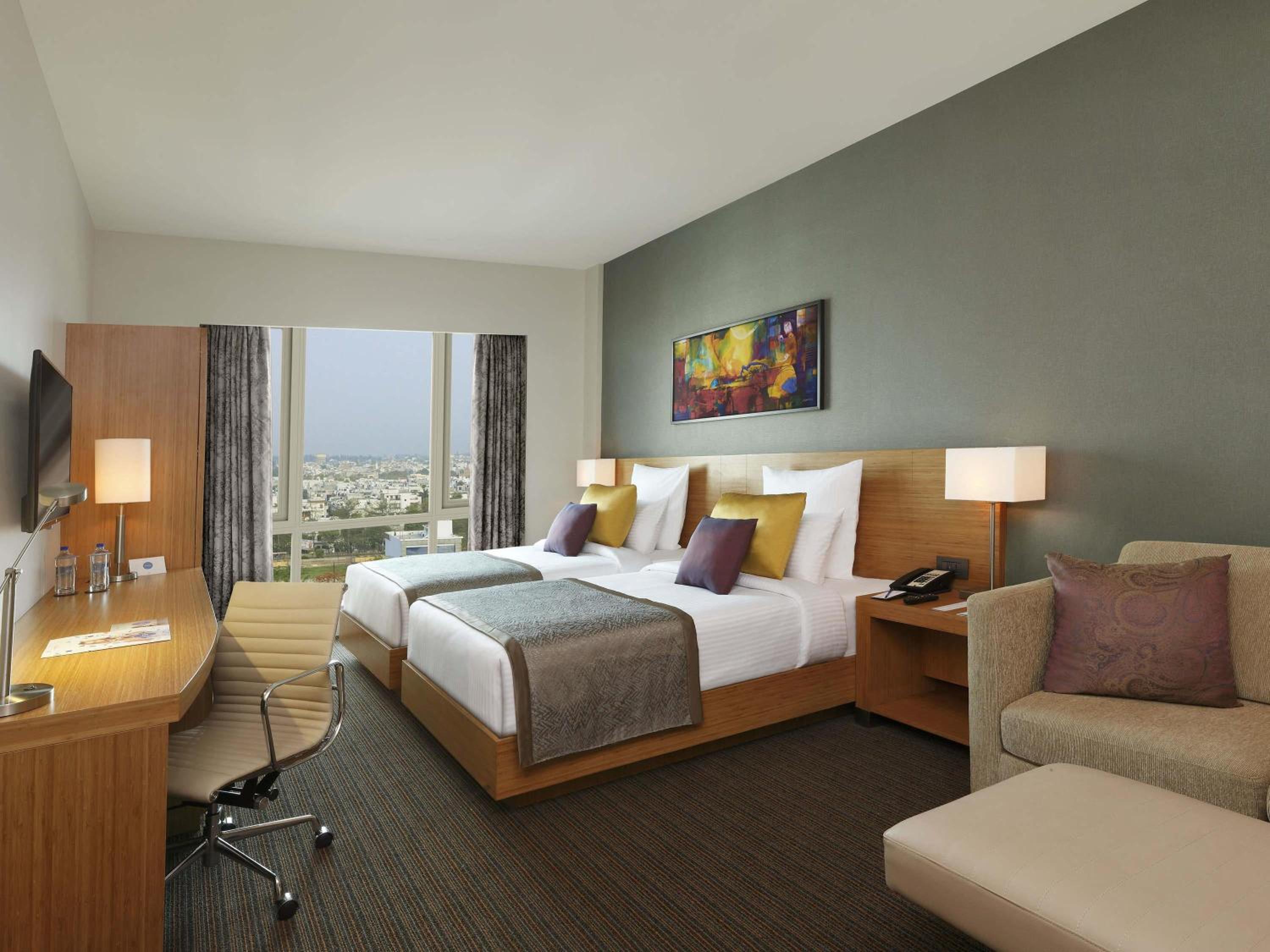 Premium Twin Room | Unlimited IMFL at the Premium Lounge from 6–8 pm, plus 20% discount on F&B, Laundry, Spa and Transport
