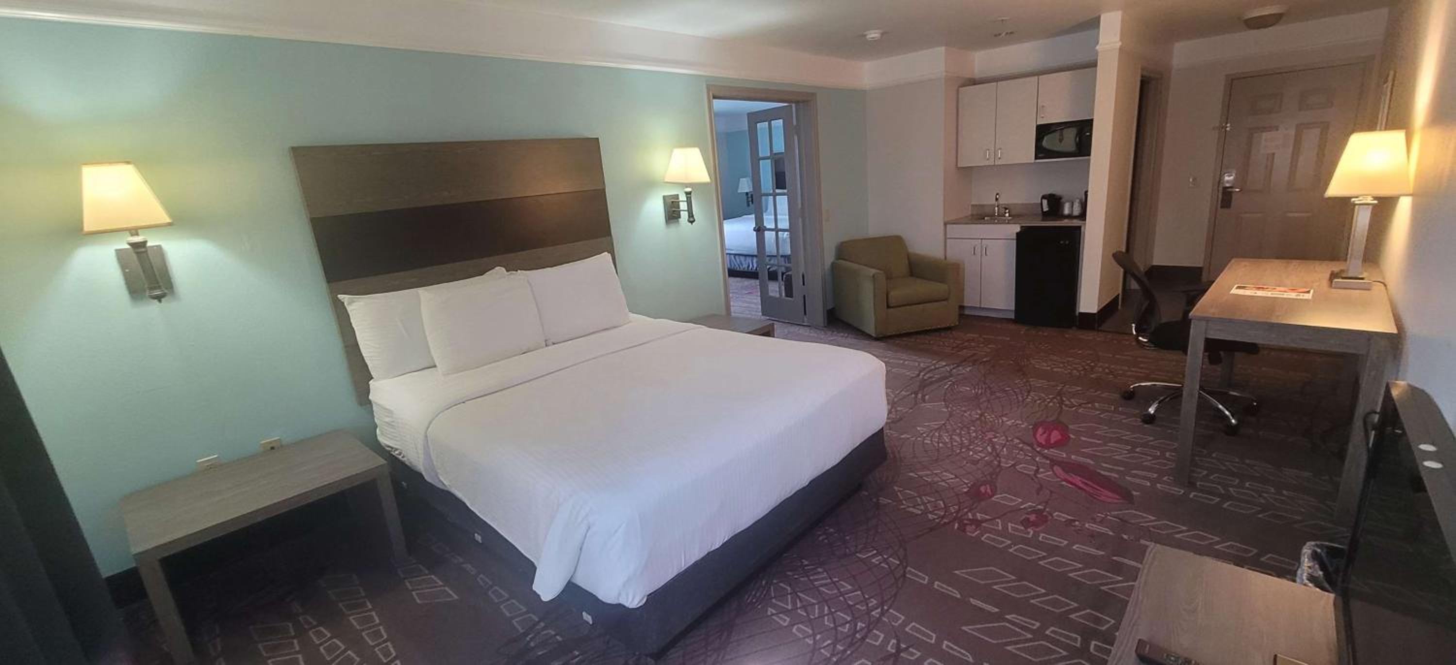 Two-Room Family Suite with One King and One Queen Bed and Bath Tub - Disability Access/Non-Smoking