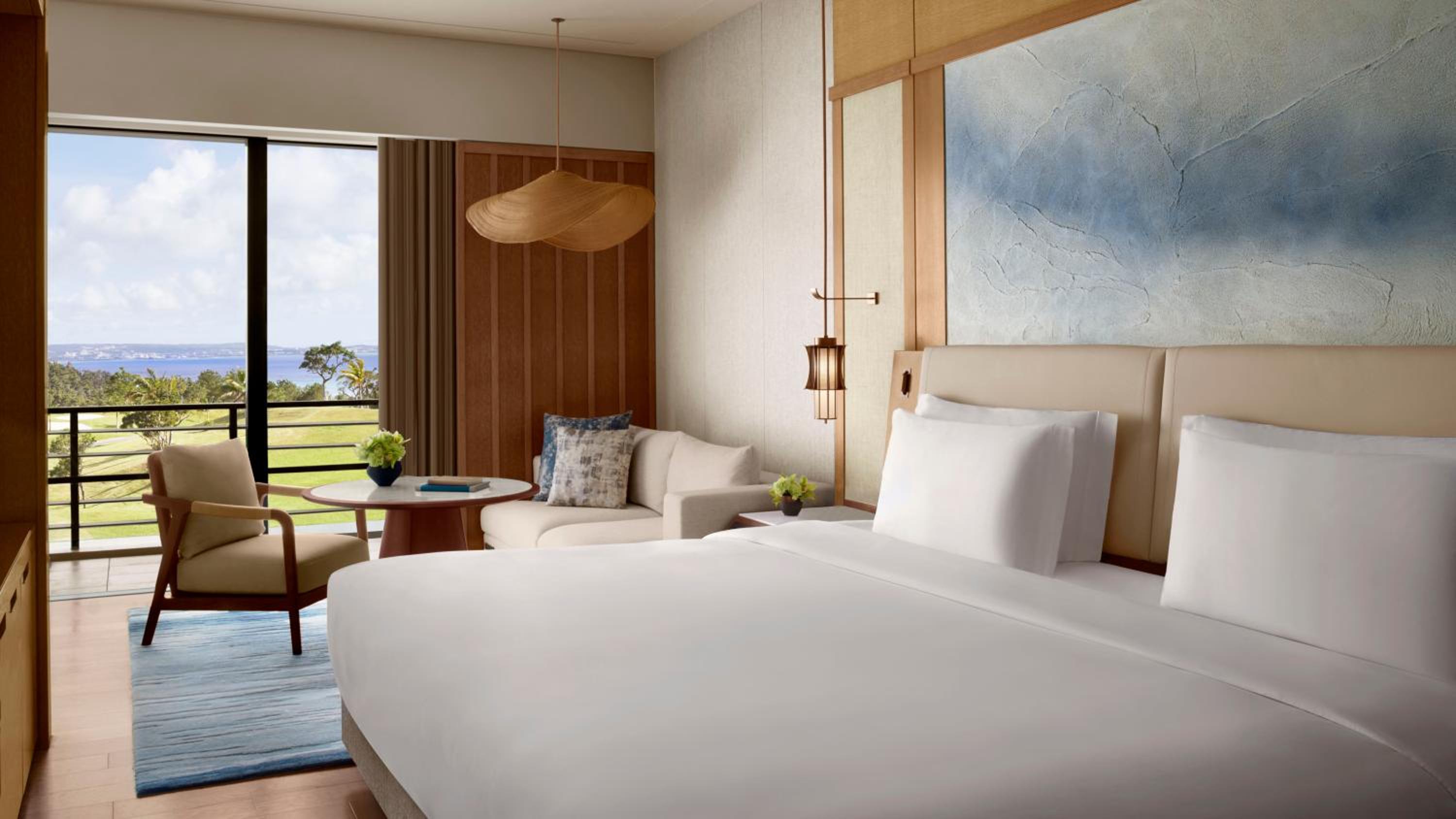 Deluxe King Room with Balcony and Partial Ocean View