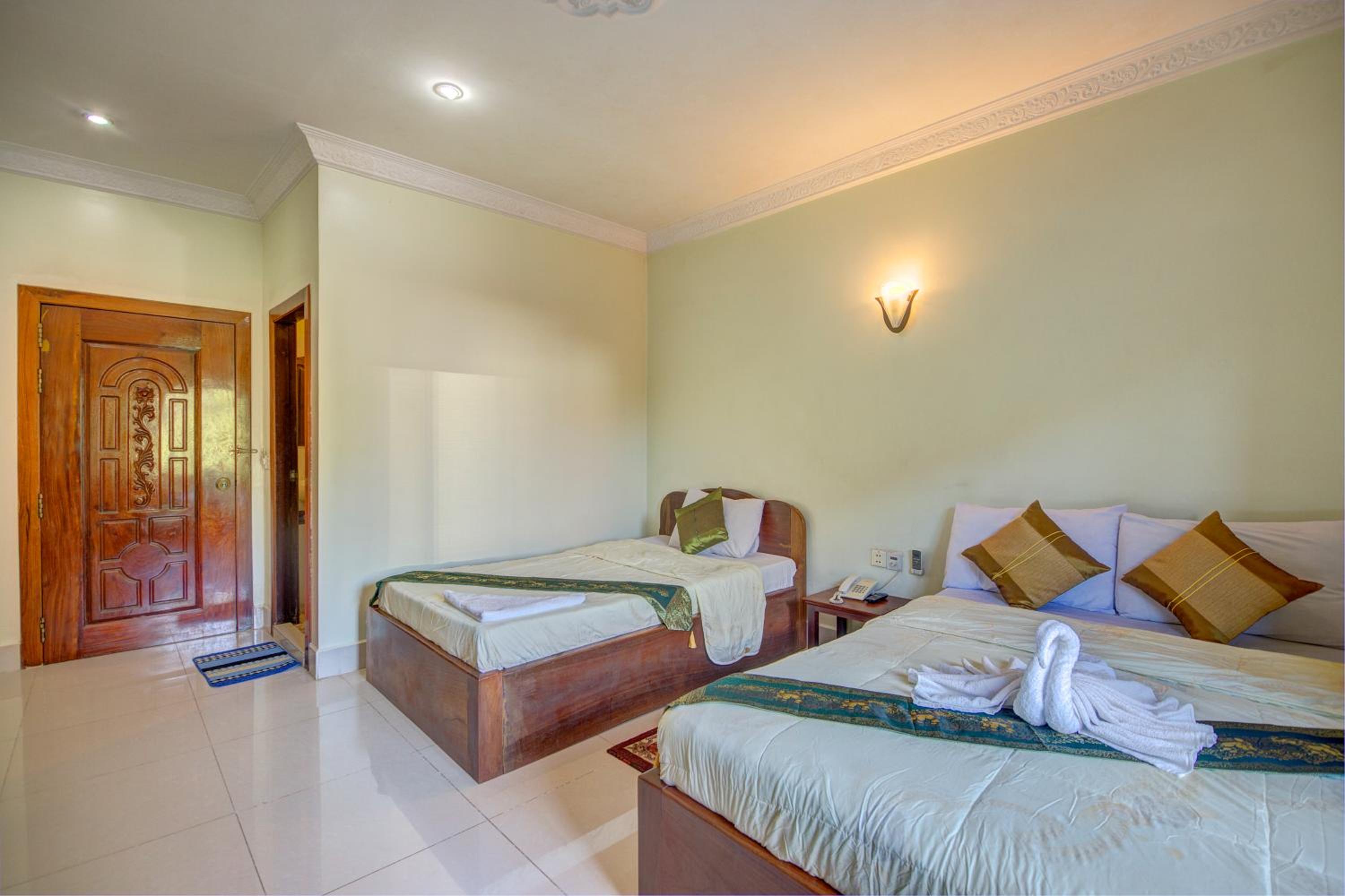 Standard Triple Room - Photo 8