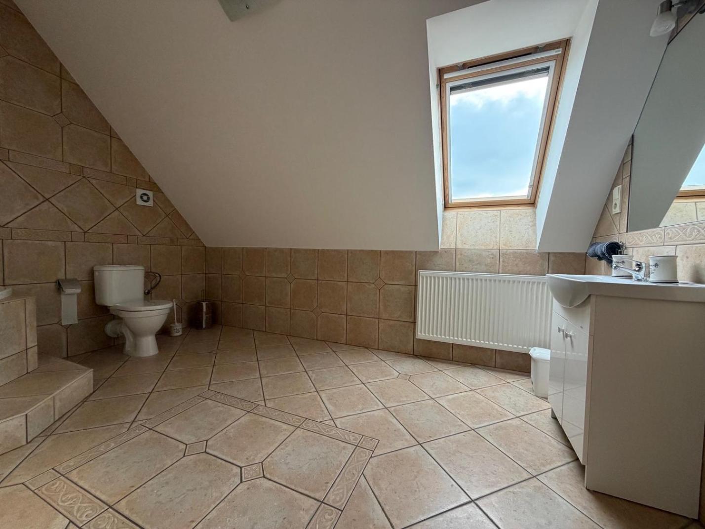 Three-Bedroom Apartment - Photo 40