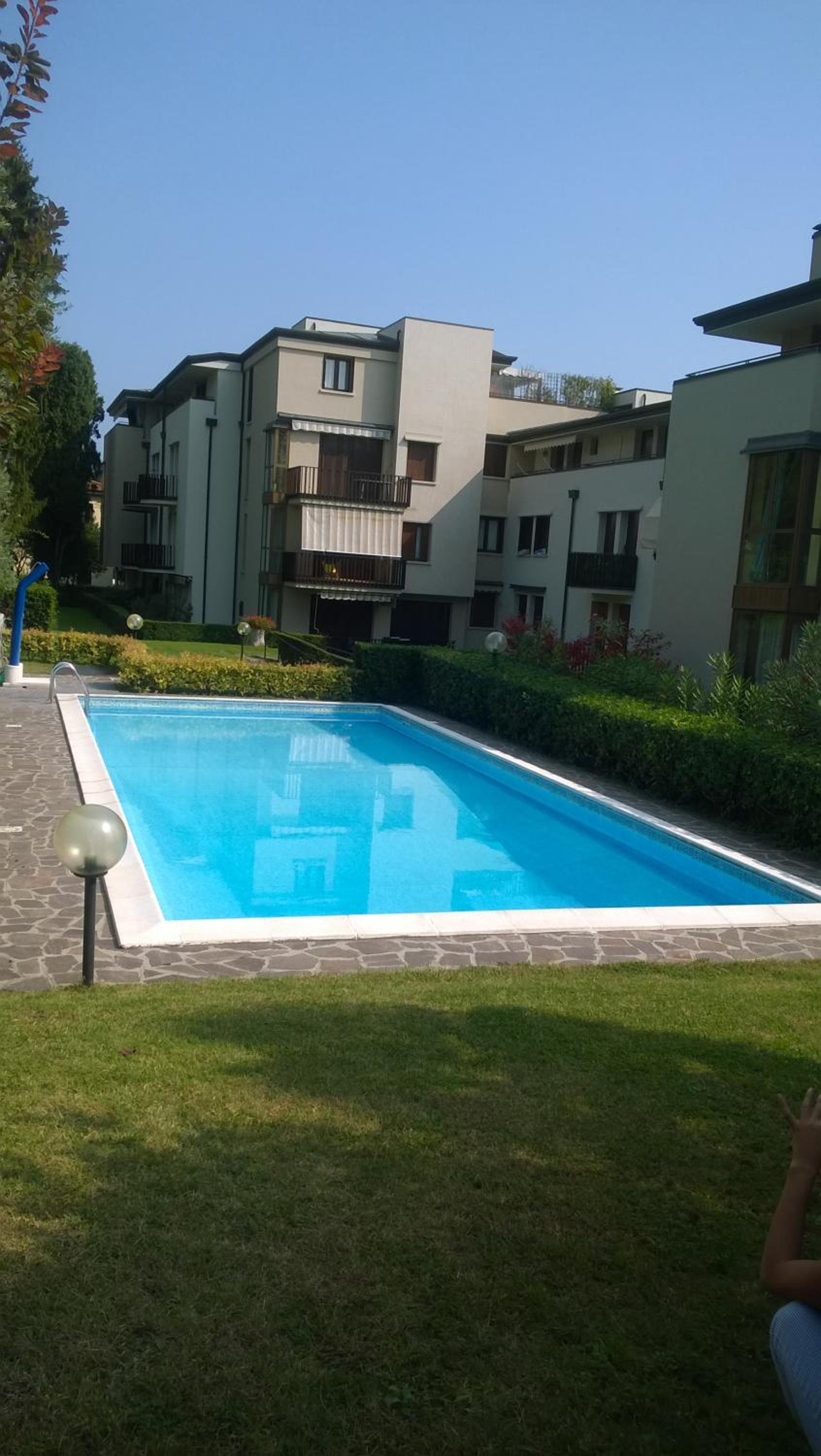 One-Bedroom Apartment with Balcony and Partial Lake View photo 2