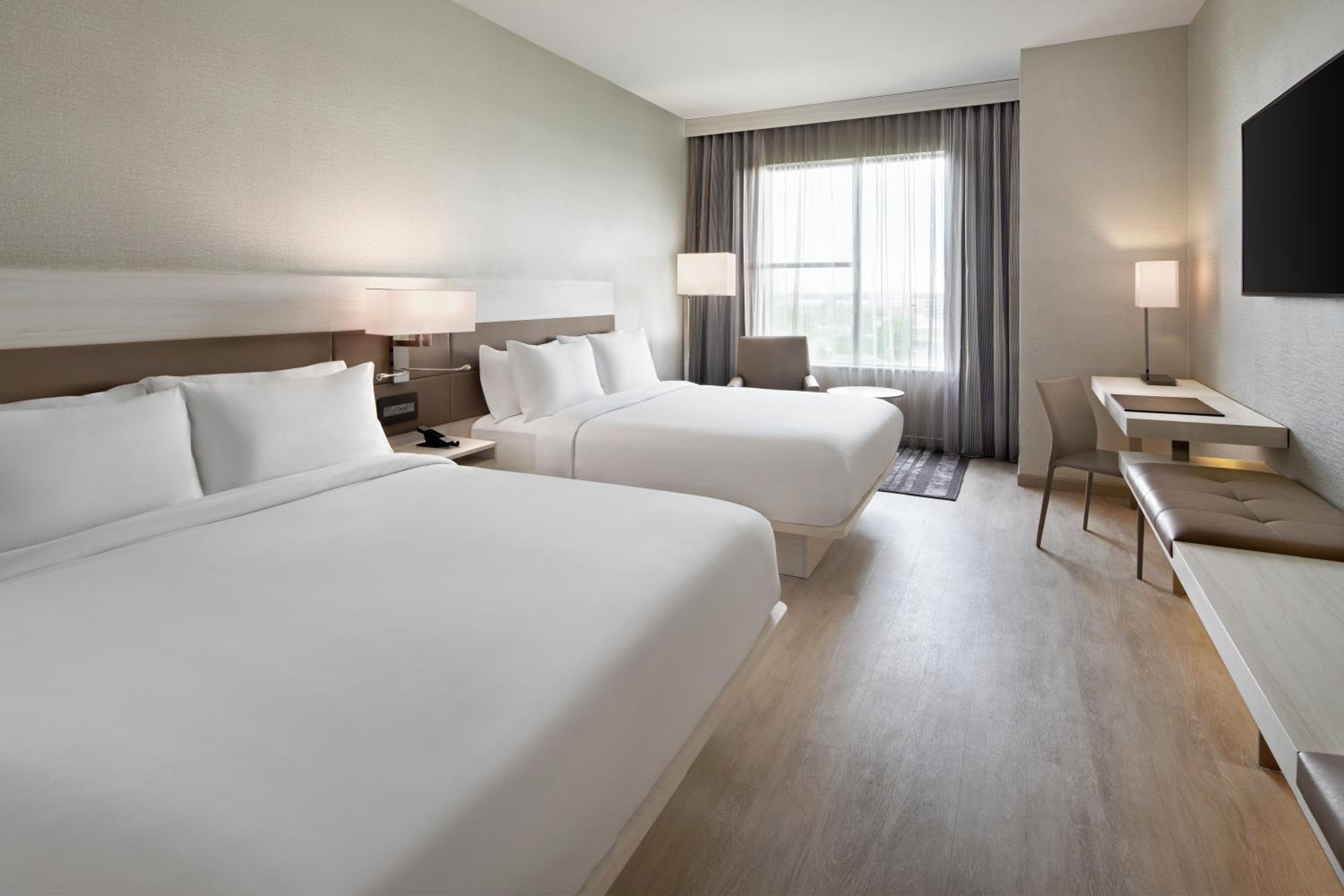 Queen Room with Two Queen Beds and Campus View - Hearing Accessible photo 1