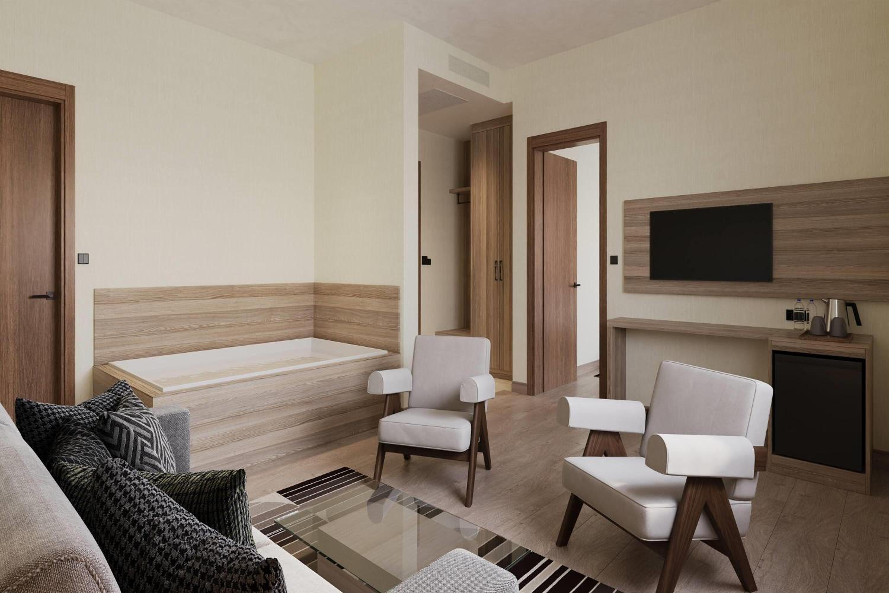 One-Bedroom Family Room with One King Bed, Sofa Bed and Jetted Tub - Non-Smoking - Photo 1