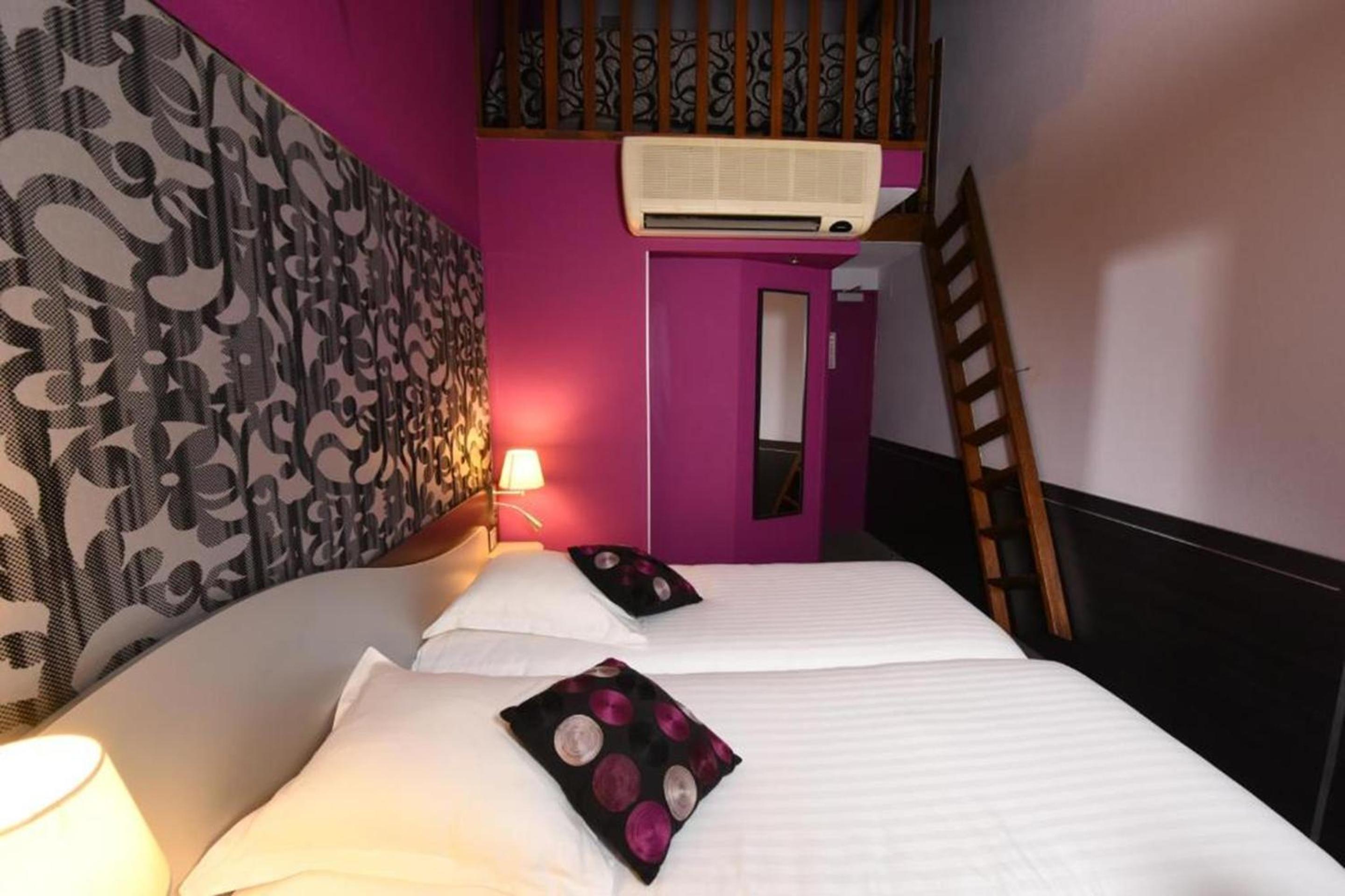 Suite with One King Bed and Two Single Beds - Non-Smoking photo 2