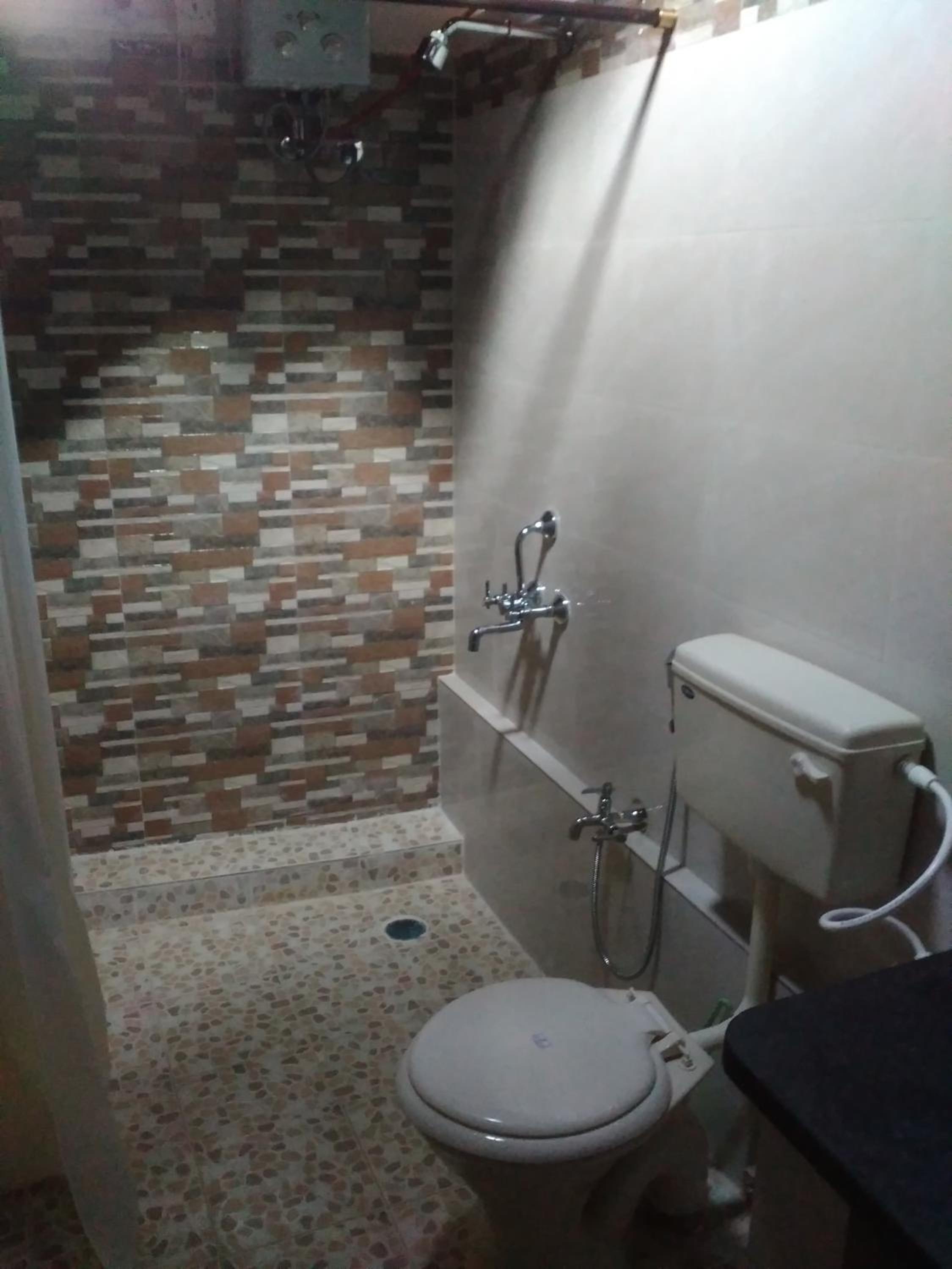Deluxe Double Room with Shower (Non AC) - Photo 18