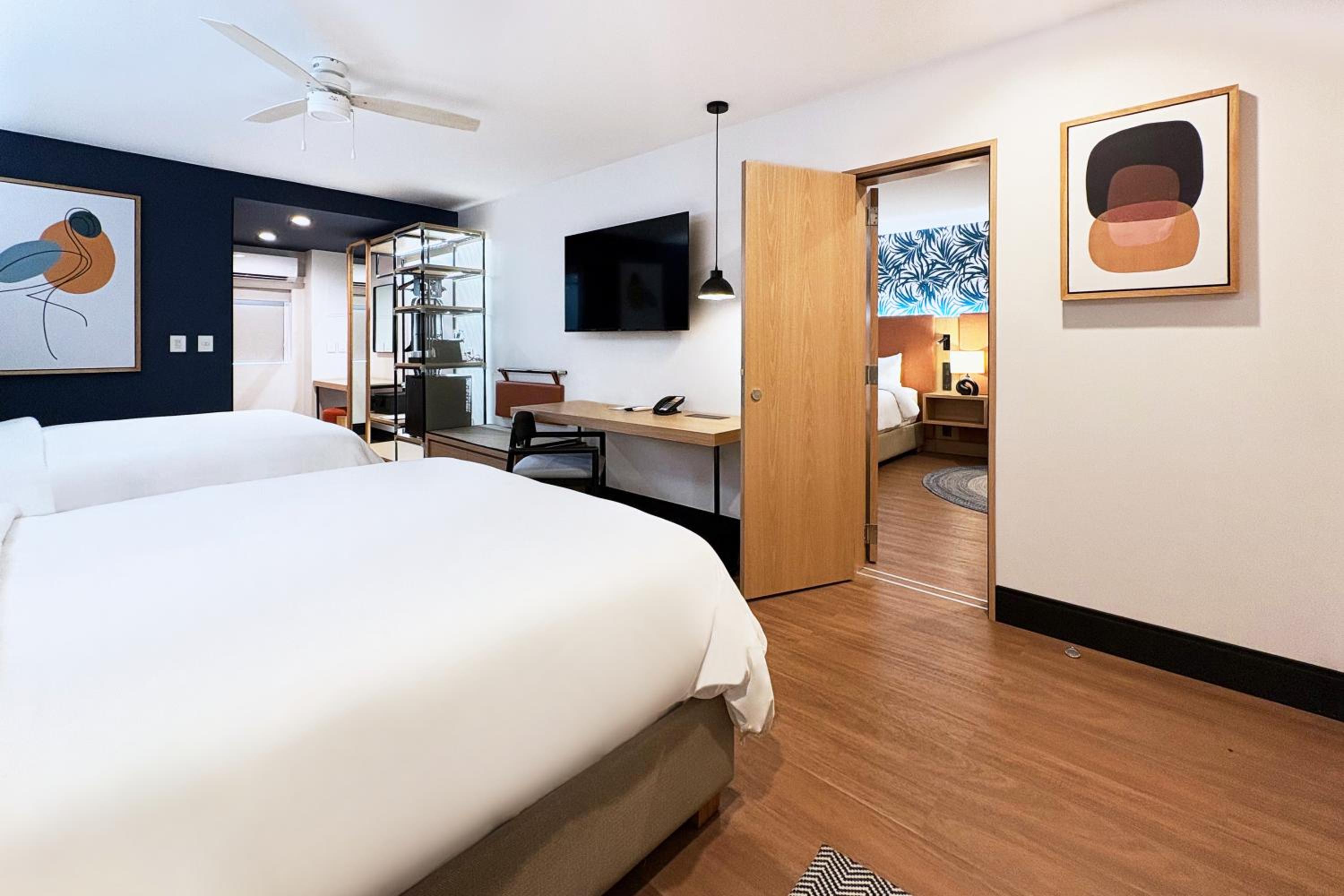 Premium Queen Room with Two Queen Beds - Photo 2